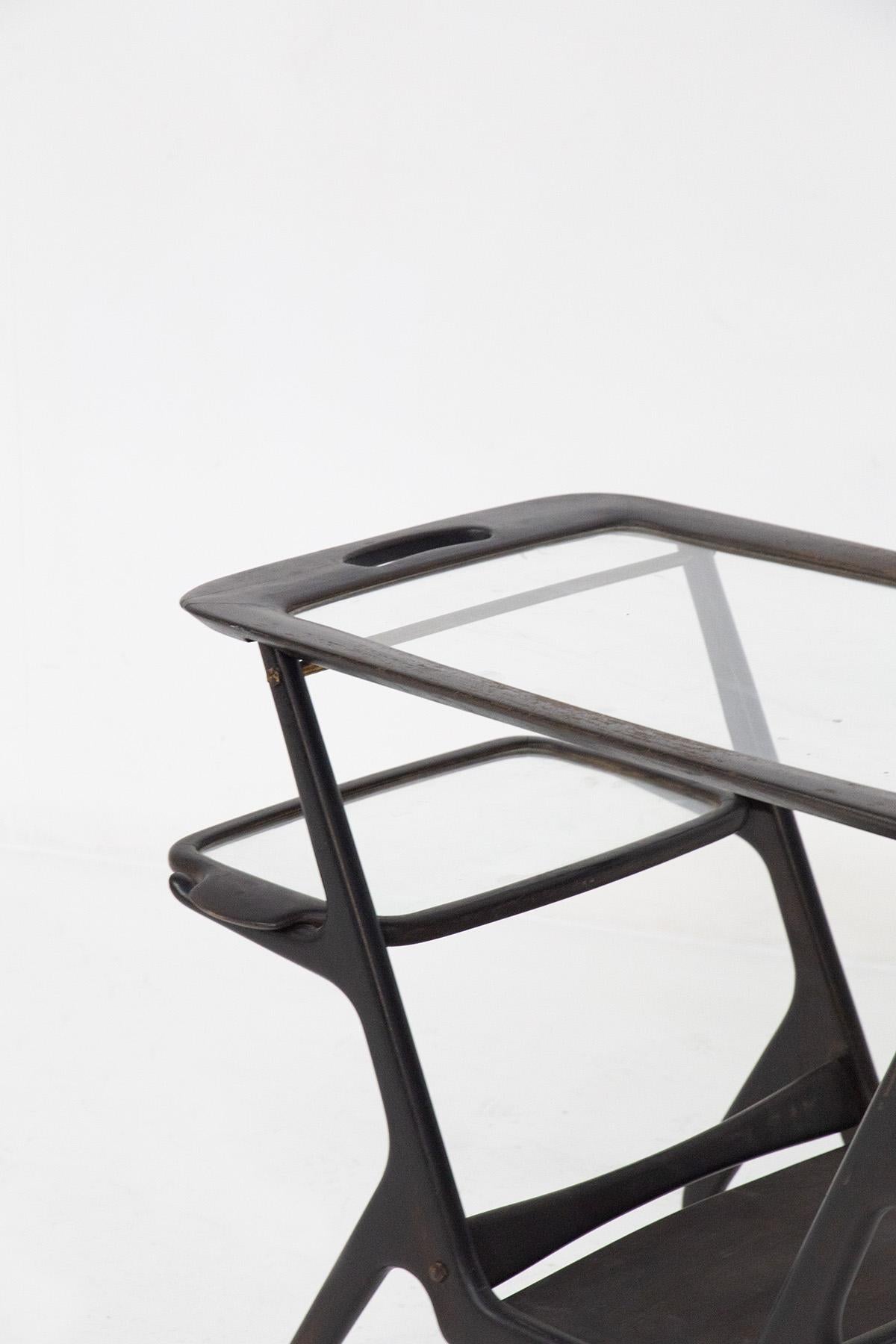 Beautiful mid-century food trolley made by Ico Parisi in the 1950s for the fine Italian manufacturer Angelo De Baggis. 
The trolley is made entirely of polished black wood, very beautiful and elegant. Its shapes are very sinuous and playful,