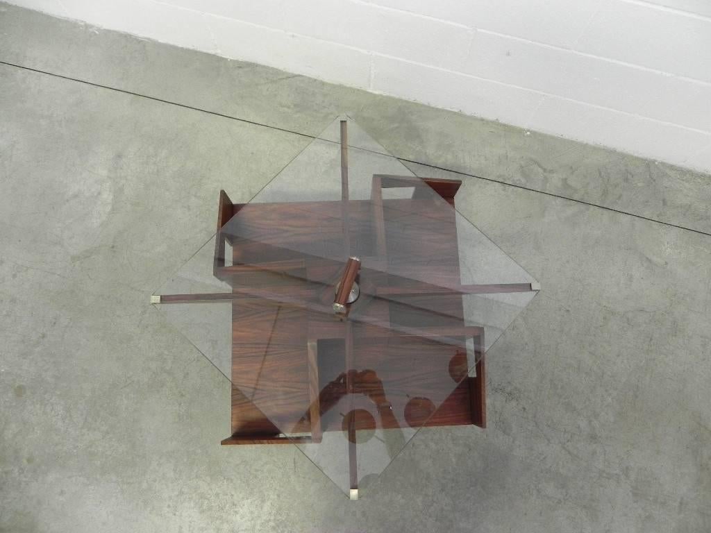 Ico Parisi midcentury rosewood origin coffee table with rotating shelves, 1950s.
