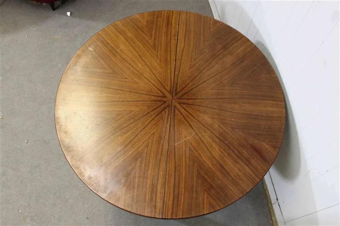 Rosewood extendable dining table, designed by Ico Parisi for MIM Roma in 1958. Ico Parisi did a full collection of home furnishings for MIM Roma and this style of leg was in main motif in his work for MIM. 

The table extends another 2 feet to
