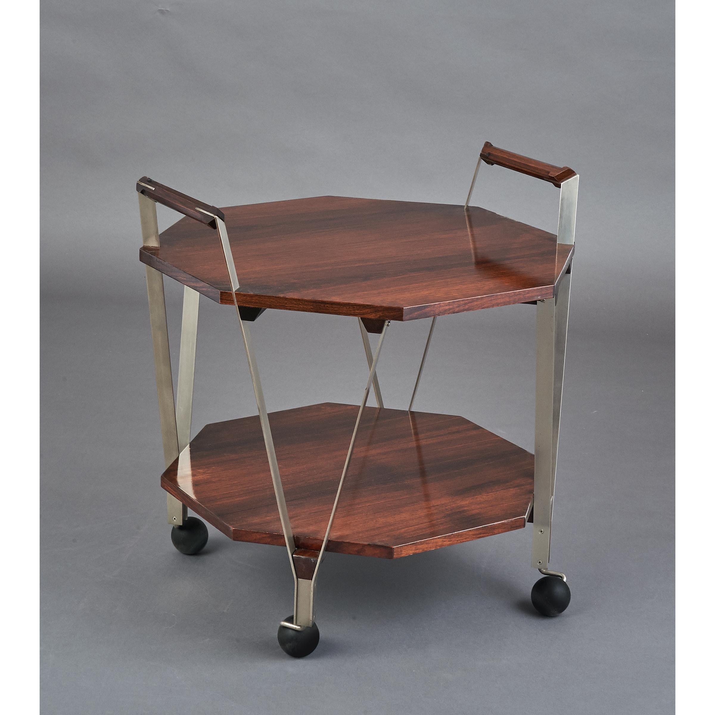 Ico Parisi, (1916-1996)
An elegant modernist two-tier octagonal rosewood rolling cart with geometric handles, satin nickeled brass mounts
Italy, 1959
Ref: Ico Parisi Catalogue Raisonné p.597
Size: 24 W x 24 D x 21 / 26 H.
TWO AVAILABLE
Sold and