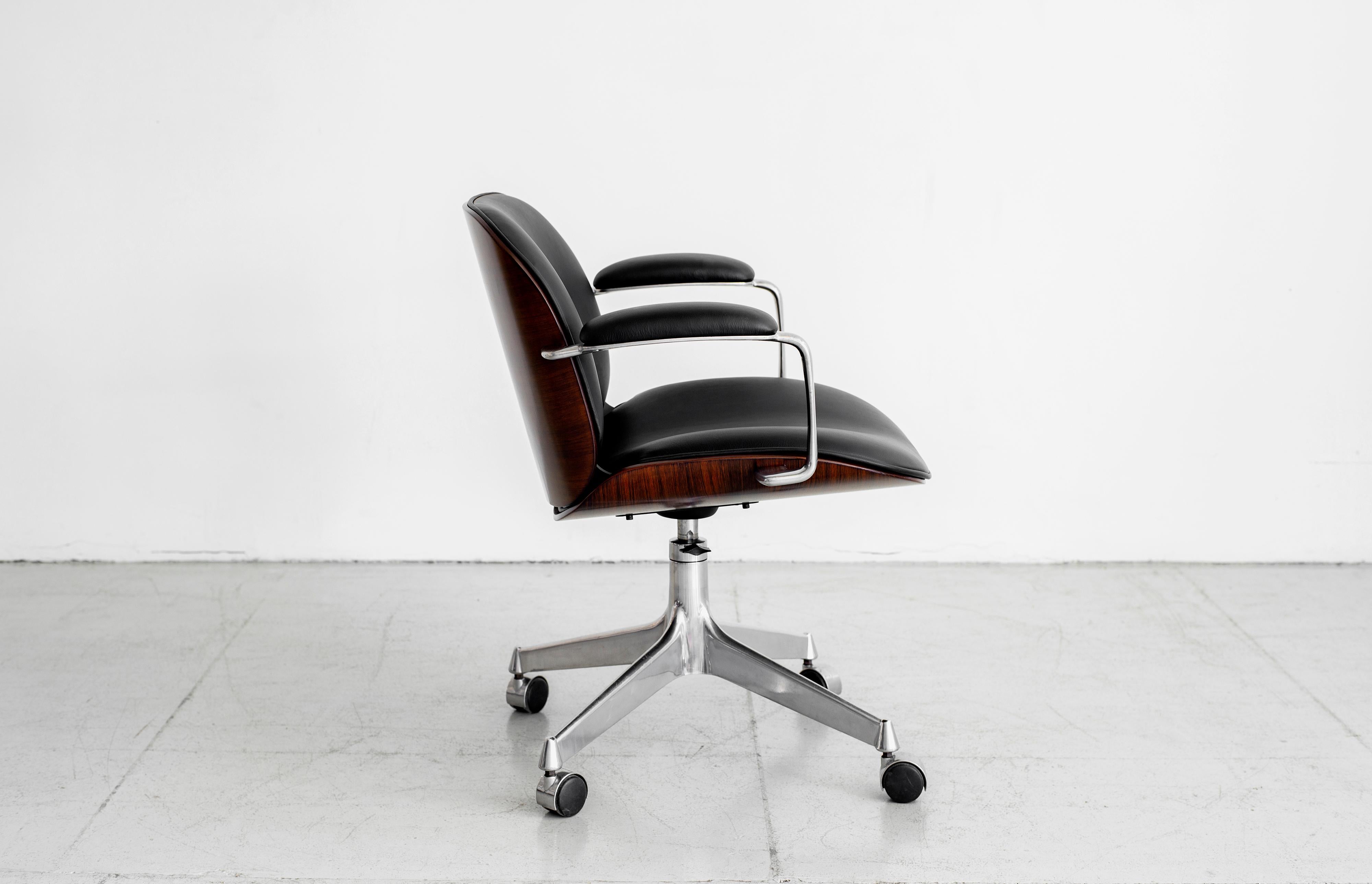 Office chair by Ico Parisi for MIM, circa 1960s.
Aluminum base with curved plywood back and newly upholstered leather seat. 
Multiple quantity available.