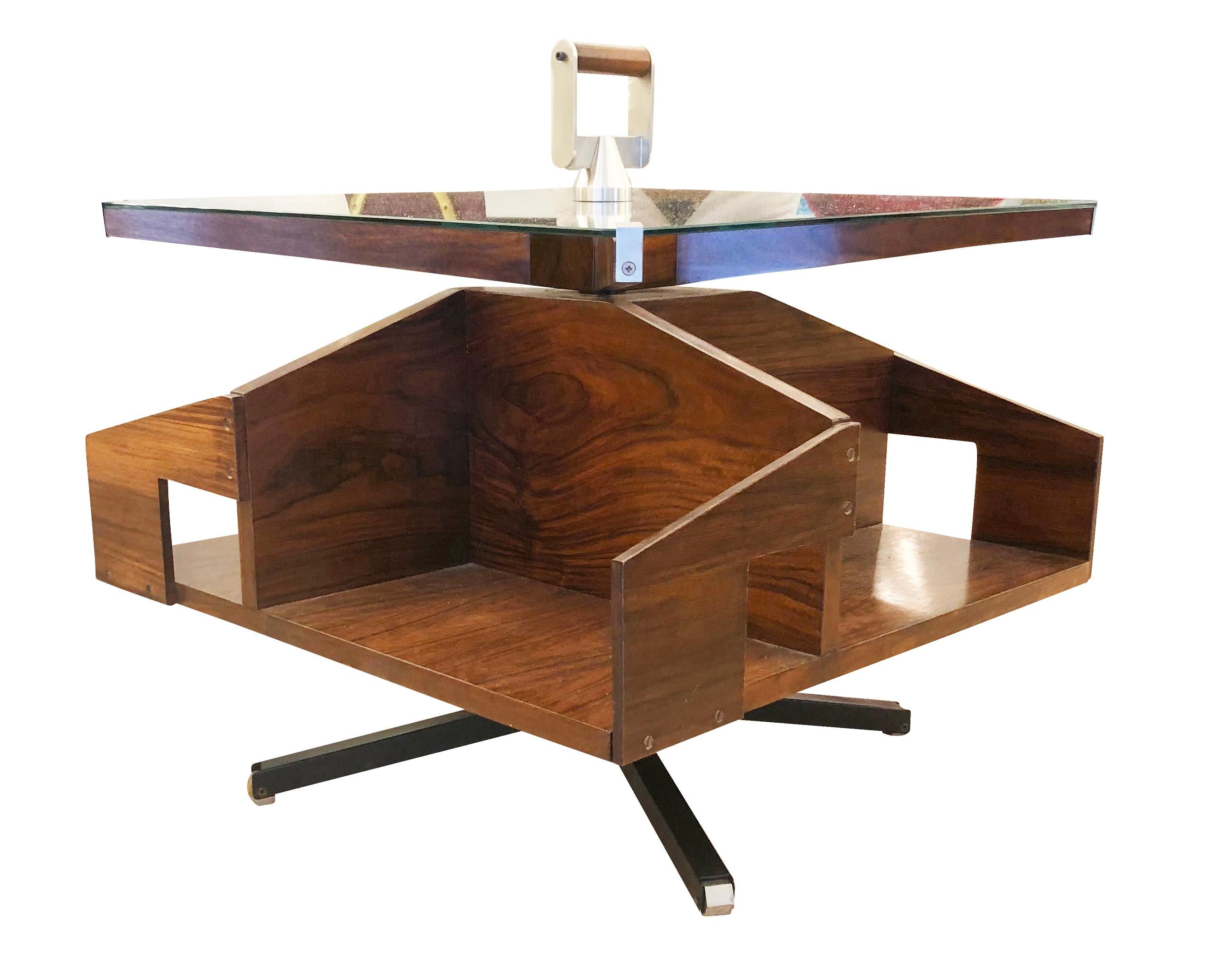 Very particular rosewood coffee or side table designed by Ico Parisi for Mobili Italiani Moderni (MIM) in the 1950s. Both the top and the compartmentalized body rotate independently creating a fun and functional piece. It also has a handle to easily