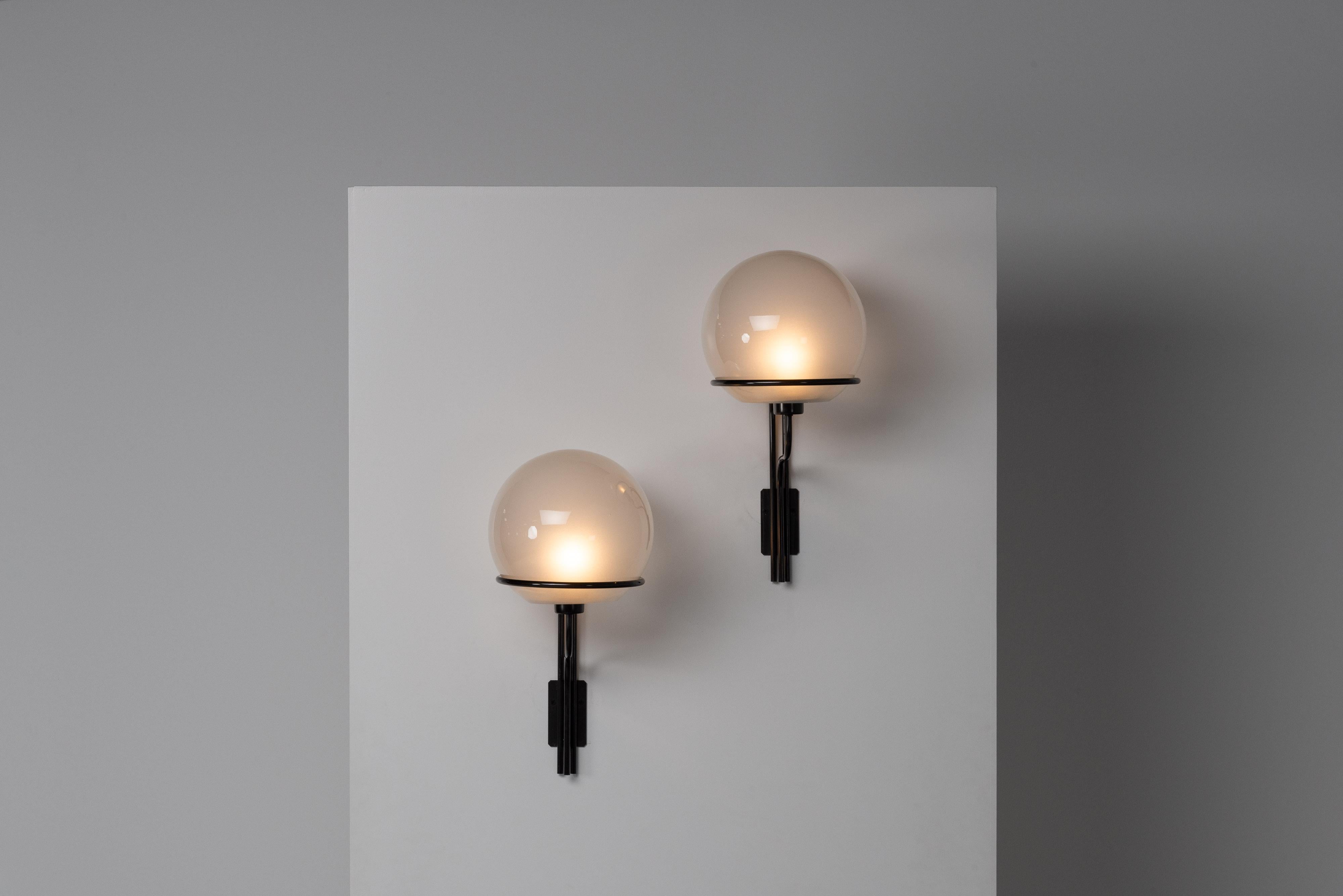 Rare large sconces model 256 designed by Ico Parisi and manufactured by Arteluce in Italy in 1964. These elegant lamps have the original frosted glass shades inside, giving a lovely diffused light. The metal structure is not only beautifully made