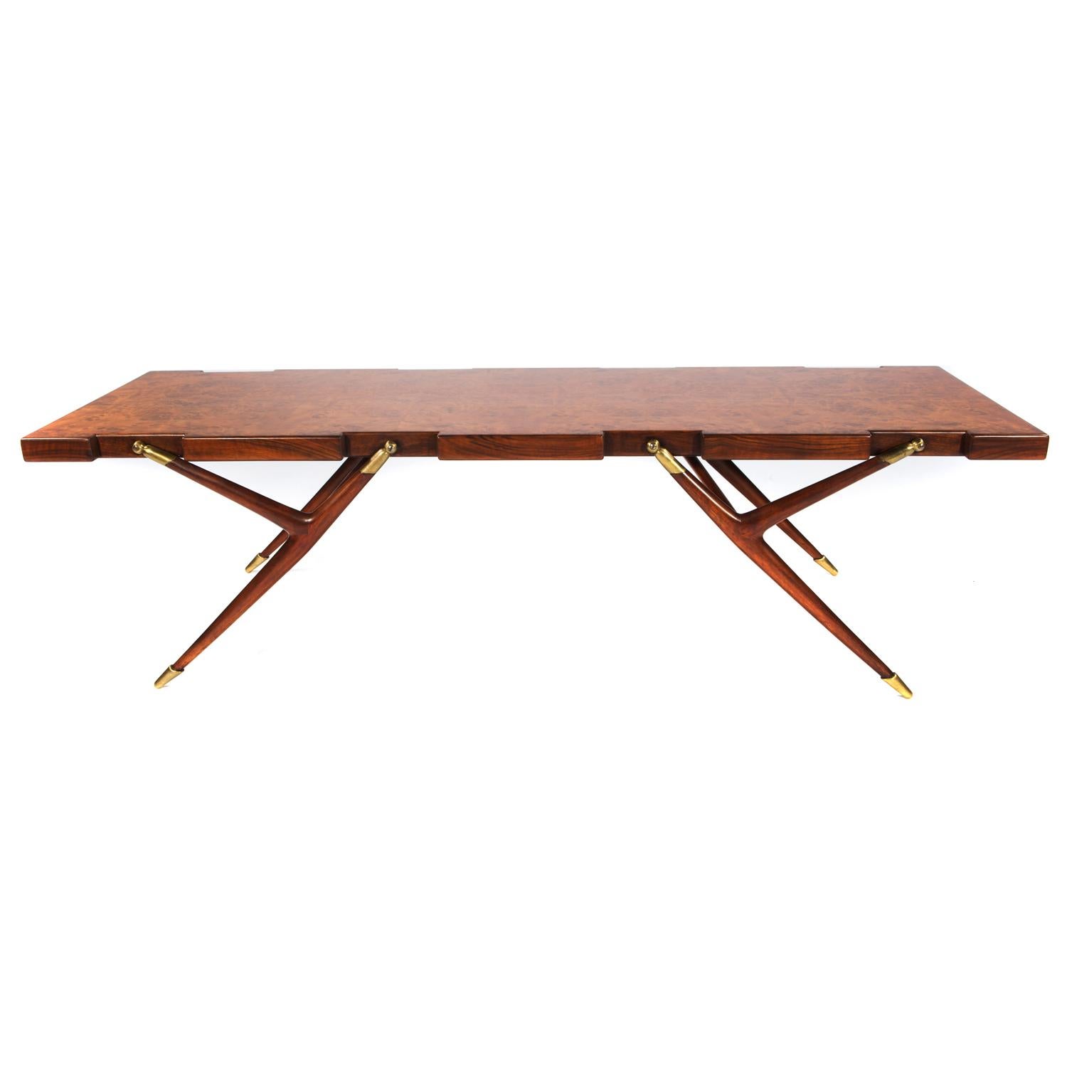 Exceptional coffee table in book-matched Italian burled walnut with sculptural legs and brass fittings by Ico Parisi (Italy) for M. Singer & Sons, American, 1950's. This table is a tour-de-force of design.