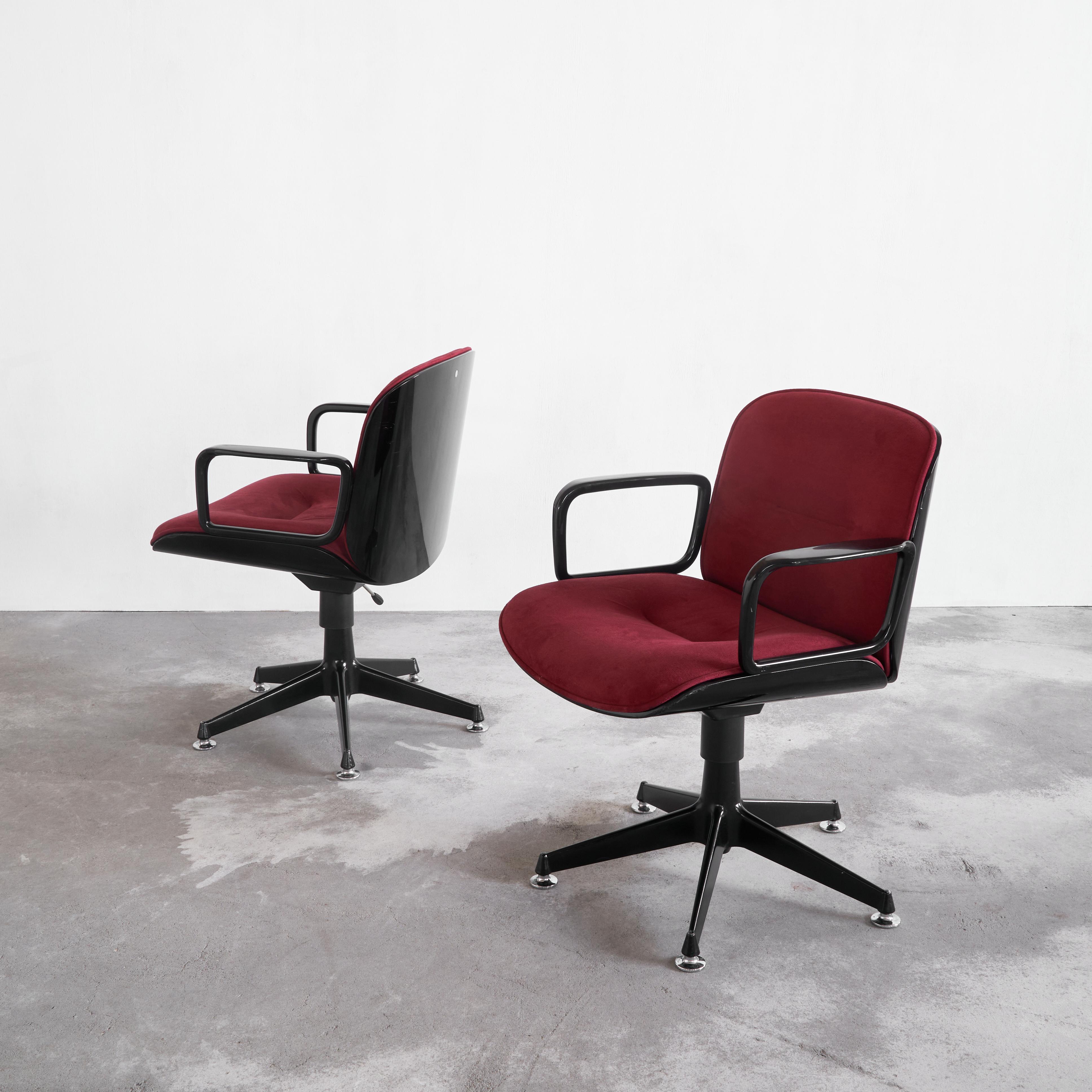 A rare set of two Ico Parisi executive swivel chairs in a striking color combination of black lacquered wood and red velvet. MIM Roma, Italy.

This particular set of chairs began their lives in the boardroom of L'Oréal in Brussels somewhere in the