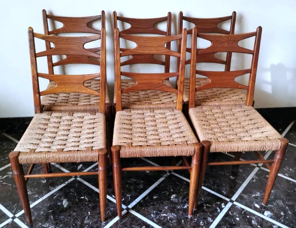 We kindly suggest that you read the entire description, as with it we try to give you detailed technical and historical information to guarantee the authenticity of our objects. Set of six chairs made of light walnut wood; the original seat was made