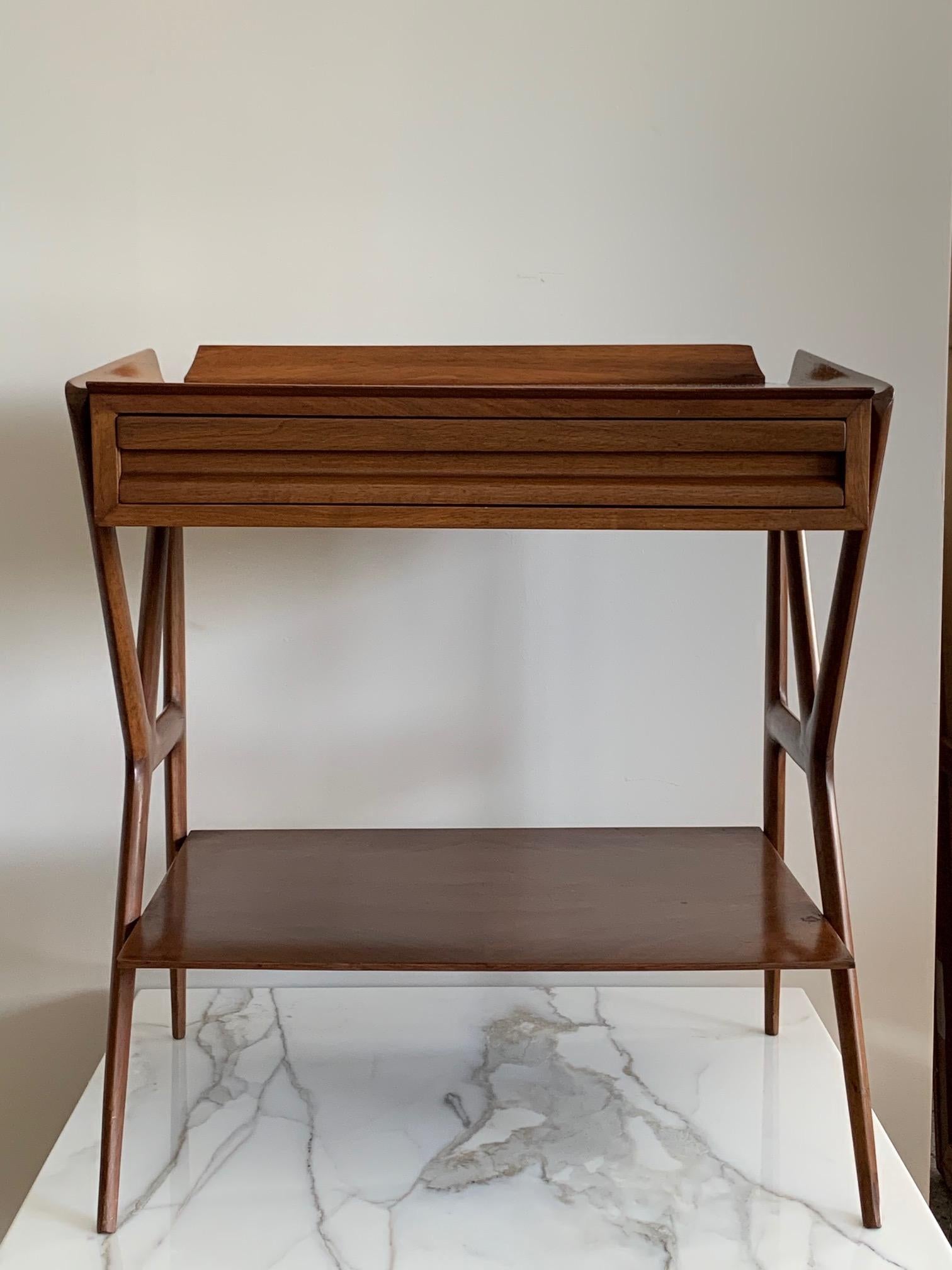 An unusual and rare occasional table by Ico Parisi, circa early 1950s. Pull out drawer, galley top, lower shelf with organic legs typical of Ico Parisi.