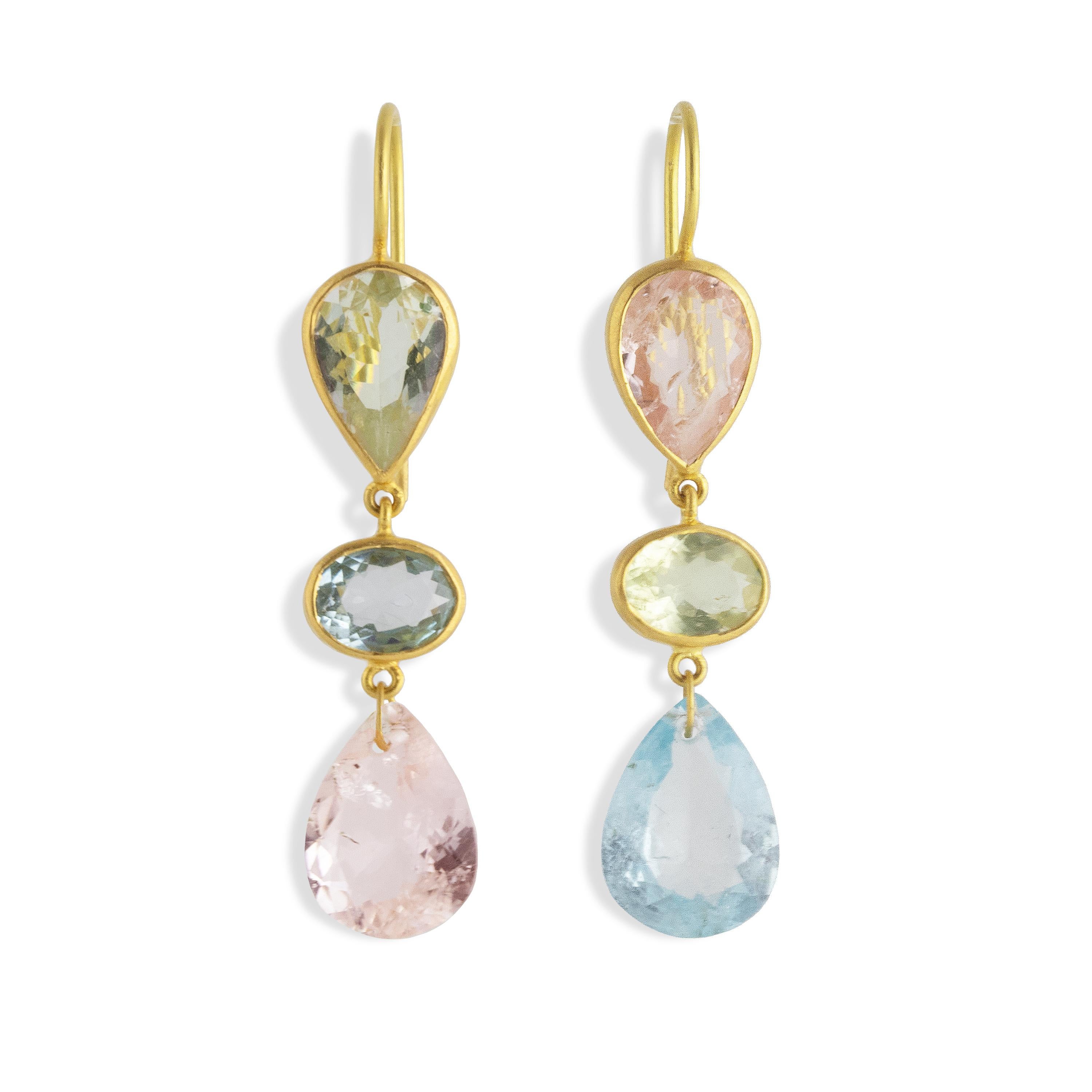 These beautiful pastel earrings are made up of various shades of gemstones from the Beryl family: Morganite, Aquamarine, and various shades of Green Beryl.  Set in 22k Matt gold.

Aquamarine is also associated with tranquility, serenity, clarity,
