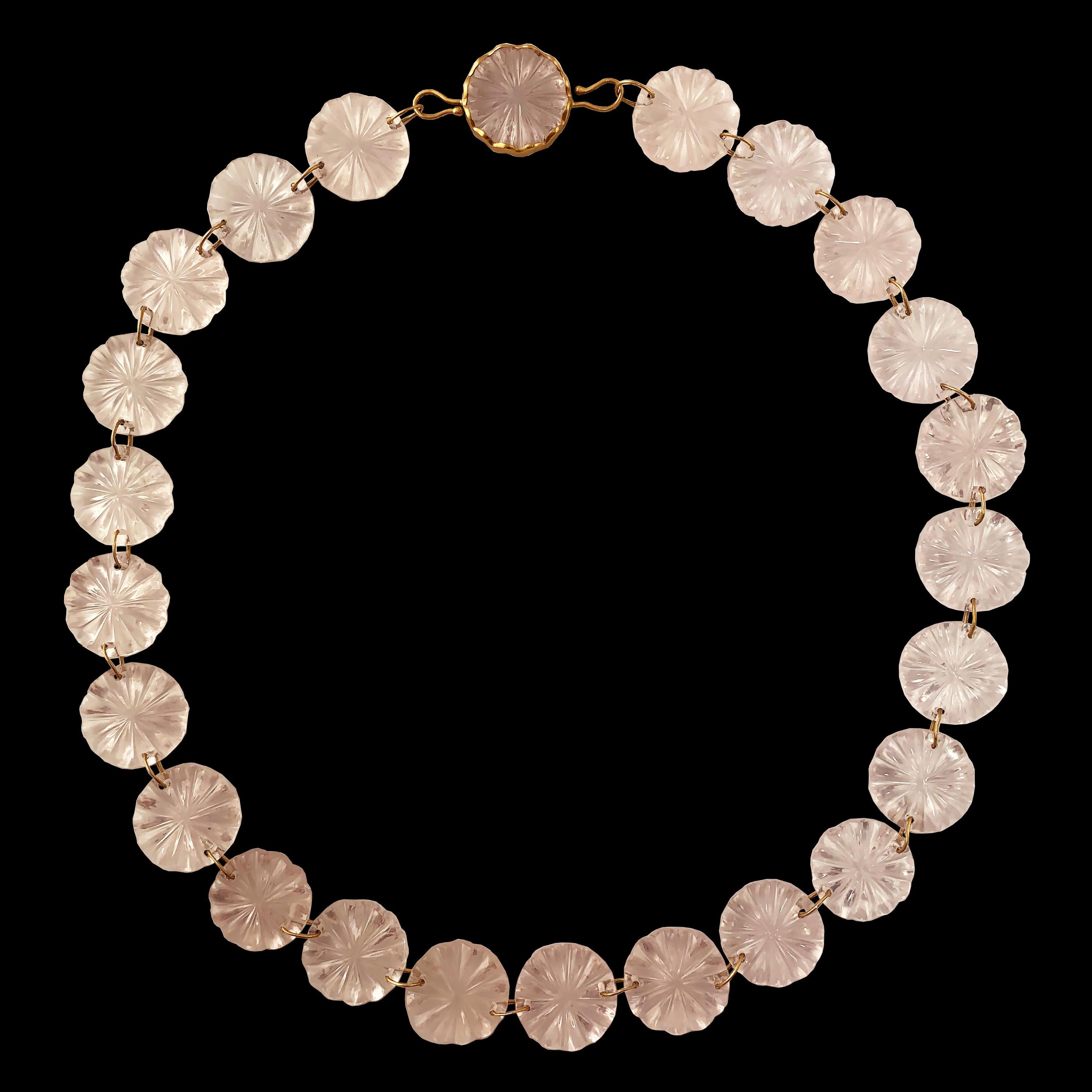 A dreamy necklace made of 240 carats of hand carved Rose Quartz discs.  Made as part of Ico & the Bird's 'Ocean Collection,' the necklace is composed of jump rings connecting the discs and completed with a disk set in a wavy bezel with a hook