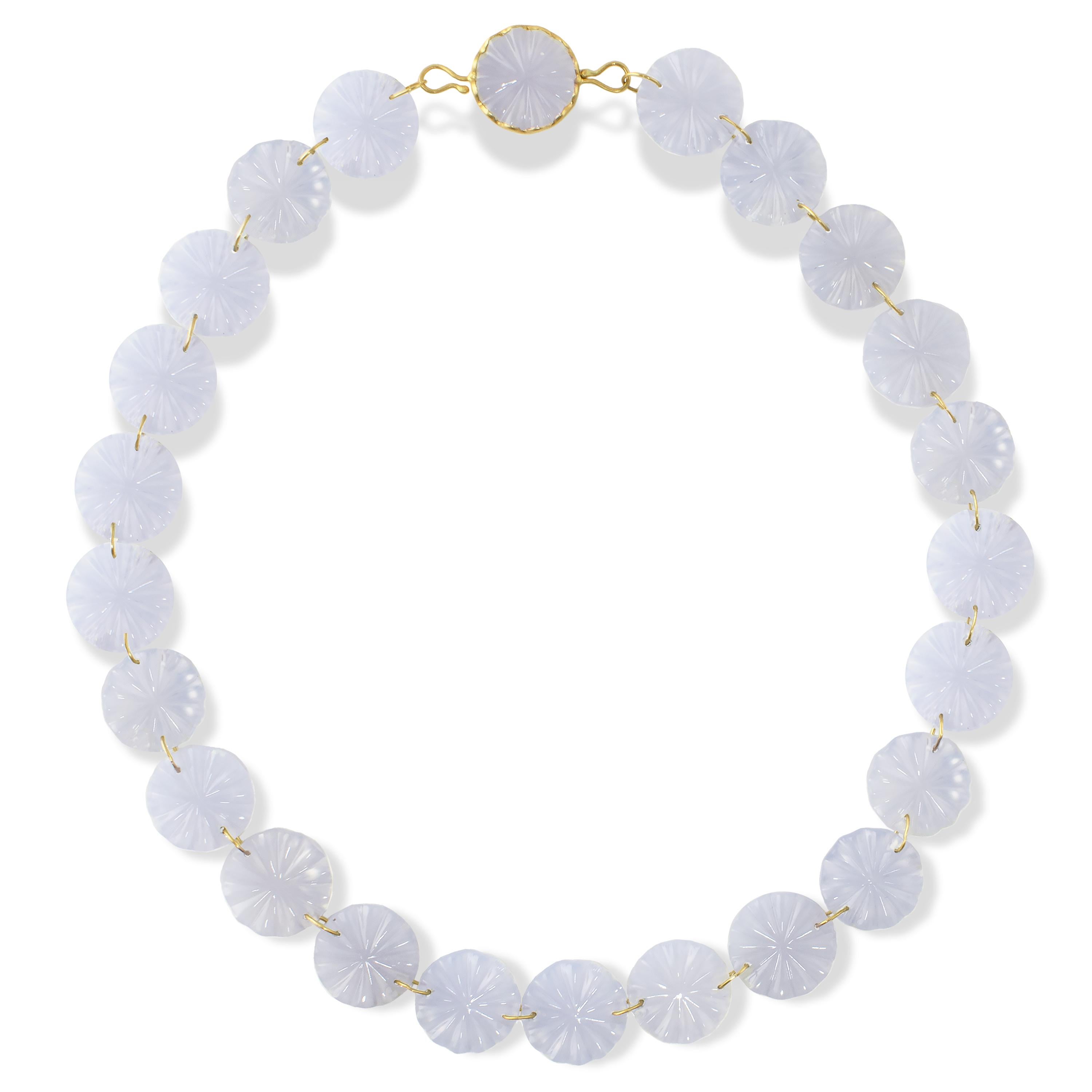 A dreamy necklace made of 255 carats of hand carved natural blue Chalcedony discs.  Made as part of Ico & the Bird's 'Ocean Collection,' the necklace is composed of jump rings connecting the discs and completed with a disk set in a wavy bezel with a