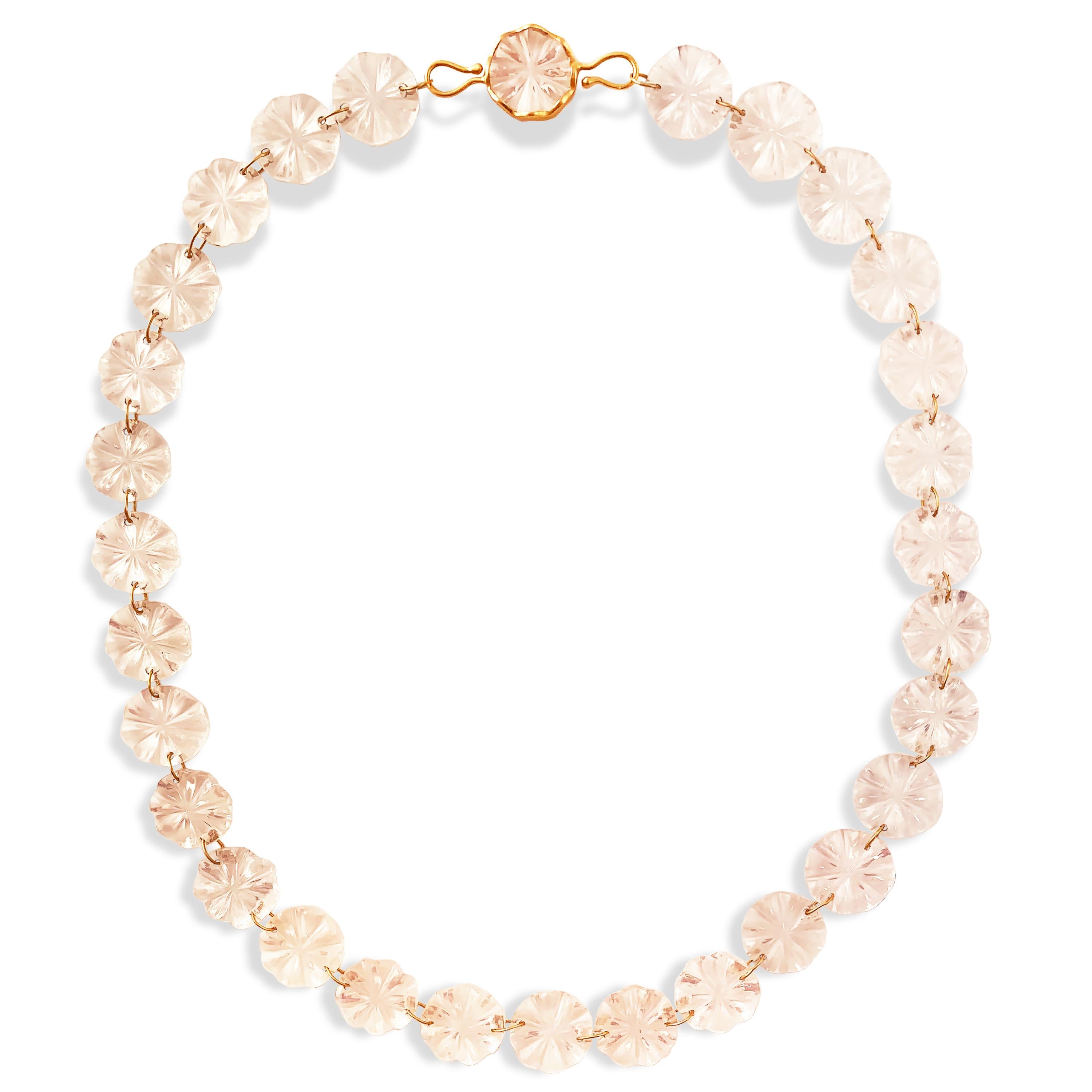 A dreamy necklace made of 240 carats of hand carved Rose Quartz discs.  Made as part of Ico & the Bird's 'Ocean Collection,' the necklace is composed of jump rings connecting the discs and completed with a disk set in a wavy bezel with a hook