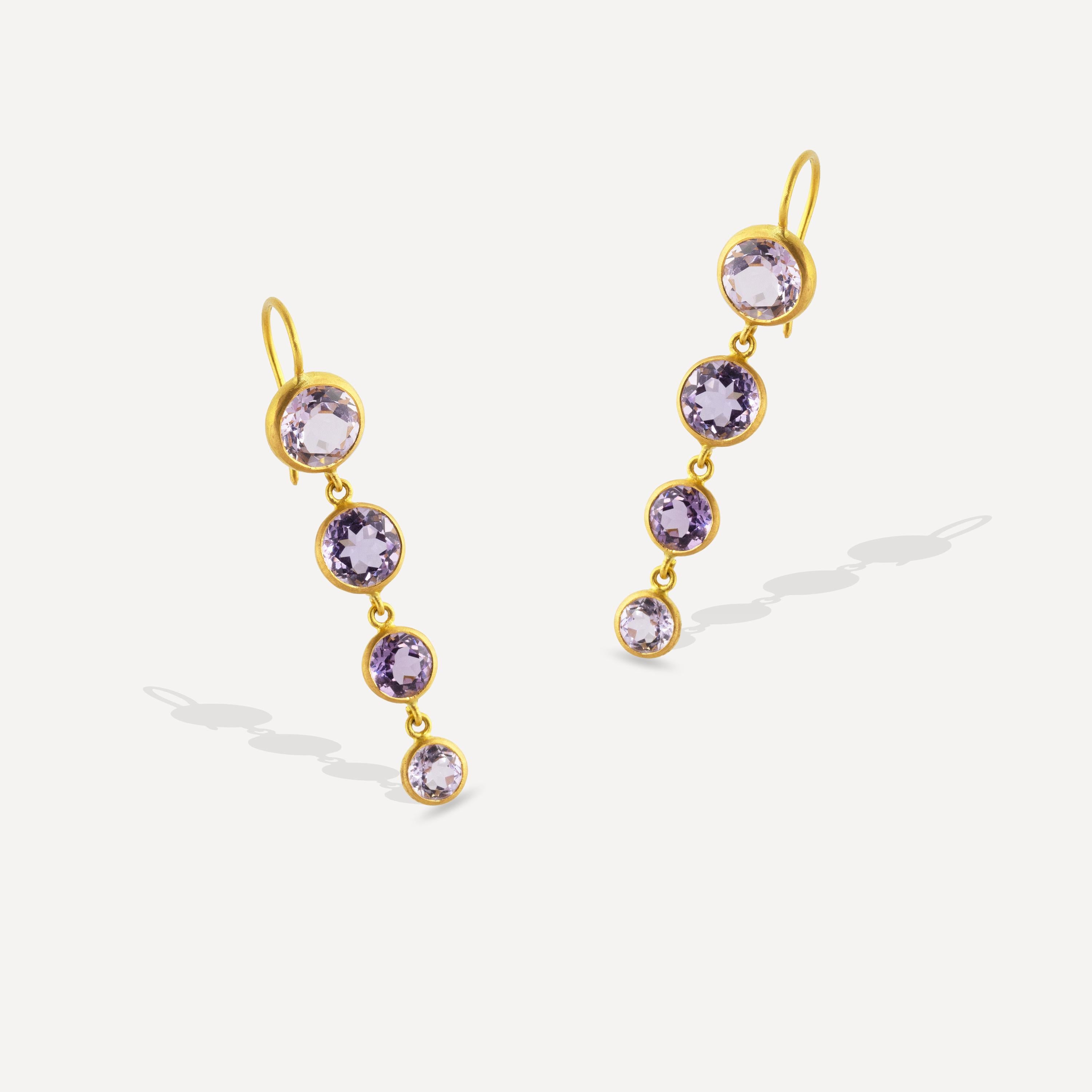 These one of a kind, sparkling earrings feature 8.14 carats of Brazilian Amethyst faceted round gemstones set in 22k Matte Yellow Gold.  A delicate drop of four drops highlight the soft violet color of the gems.  
These earrings were made by master