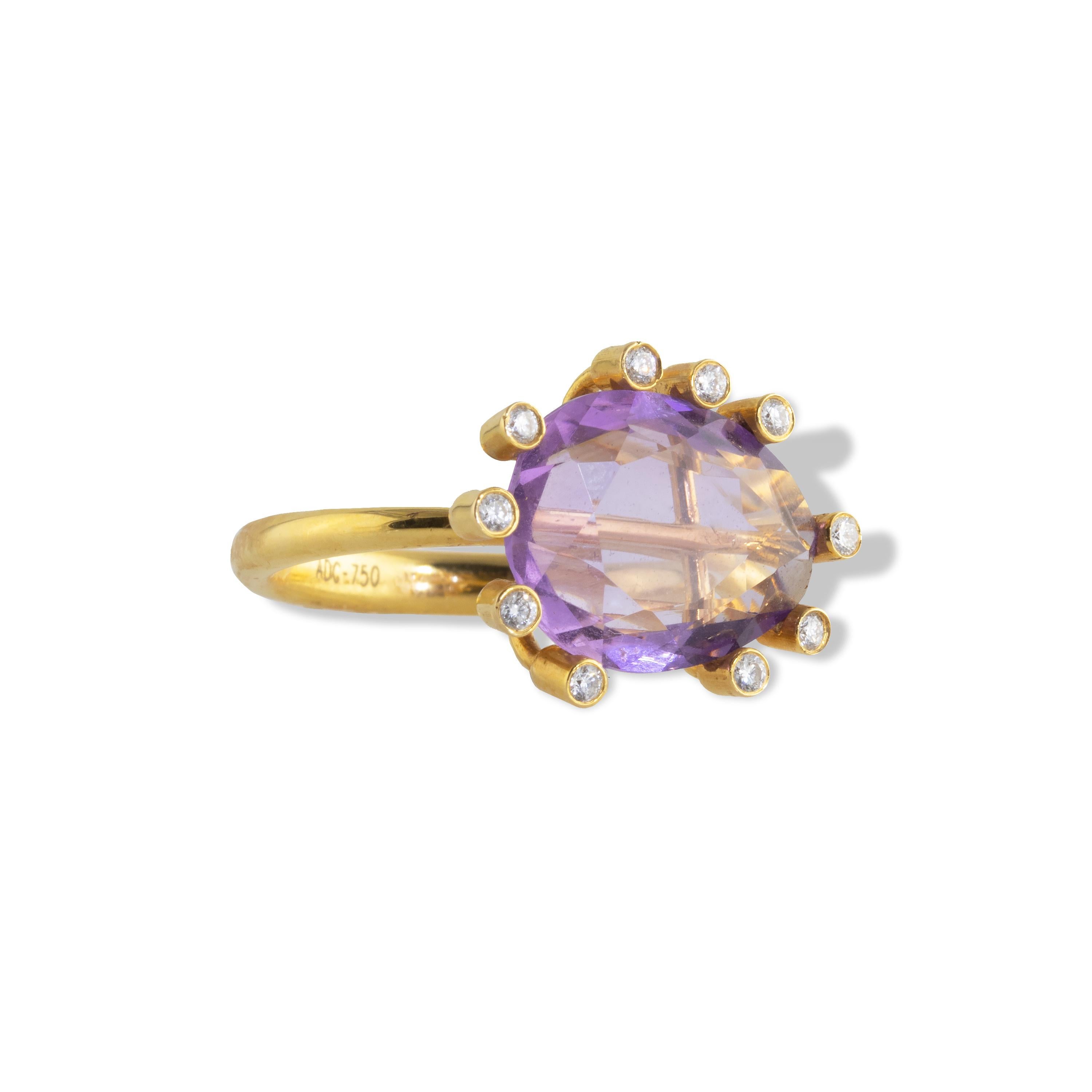 An elegant and dramatic ‘Open Cage’ ring with asymmetrical diamond clusters surrounding a large center 12 carat Amethyst gem. The concept for this piece came from a cage collection and represents an open cage construction with the cage showing