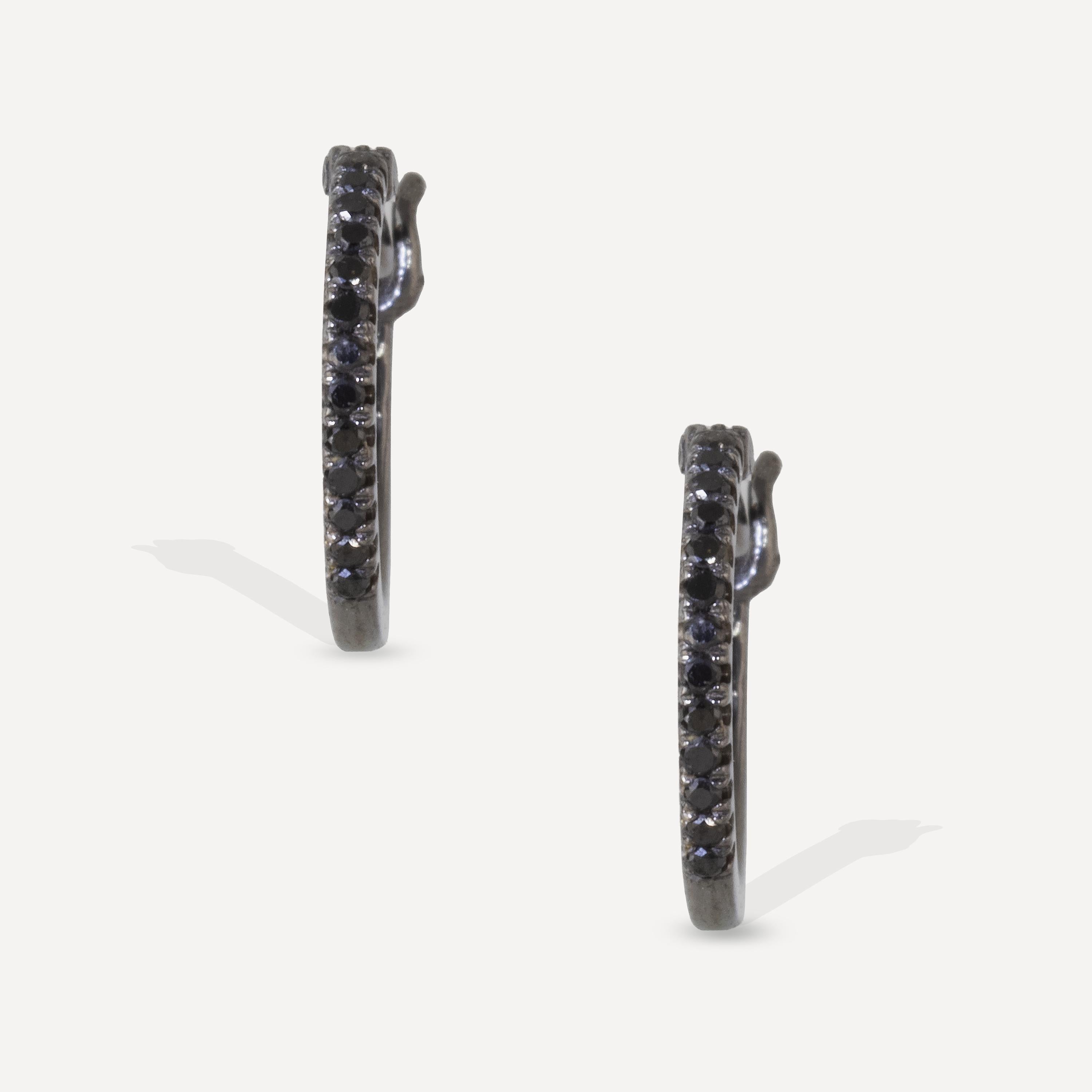 From the essentials collection, these black diamond hoops feature 26 black diamonds set in 18k blackened gold, with 14k posts.
Black diamonds are  used for protection and to absorb and deflect negative energy. The deep black color of these stones is
