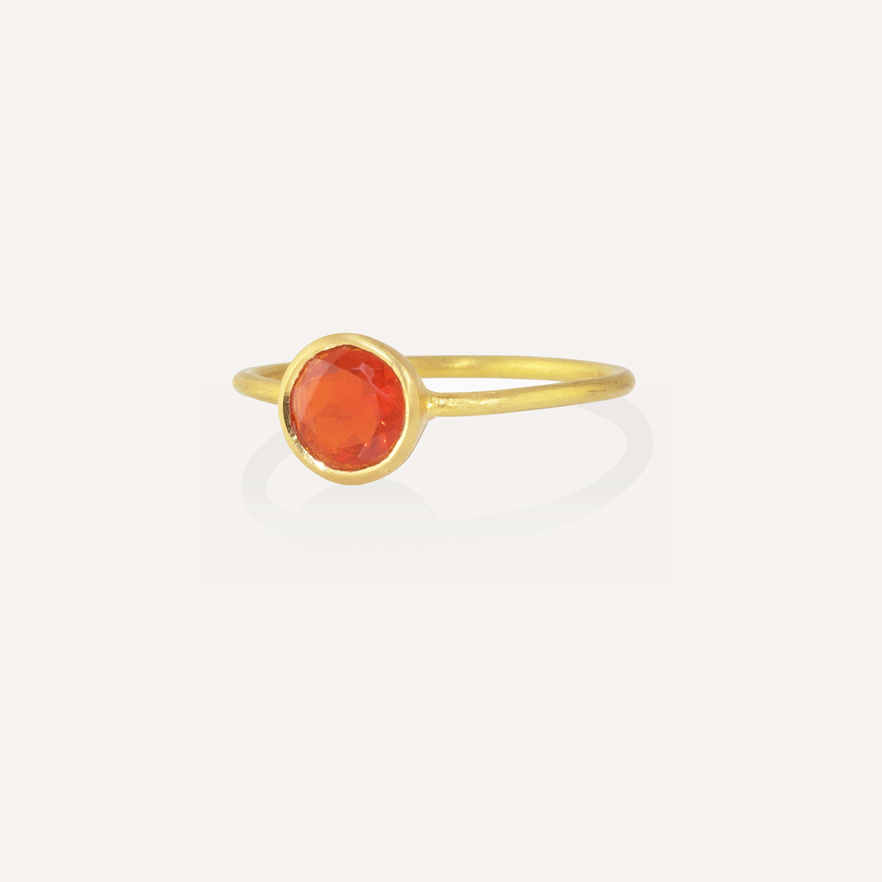 The 22k gold ring features a bright orange 6mm Fire Opal. Wear this alone or in combination with other rings for a pop of color. 

Mexican Fire Opal has been prized since ancient times, as symbols of the deepest and strongest love. However, the