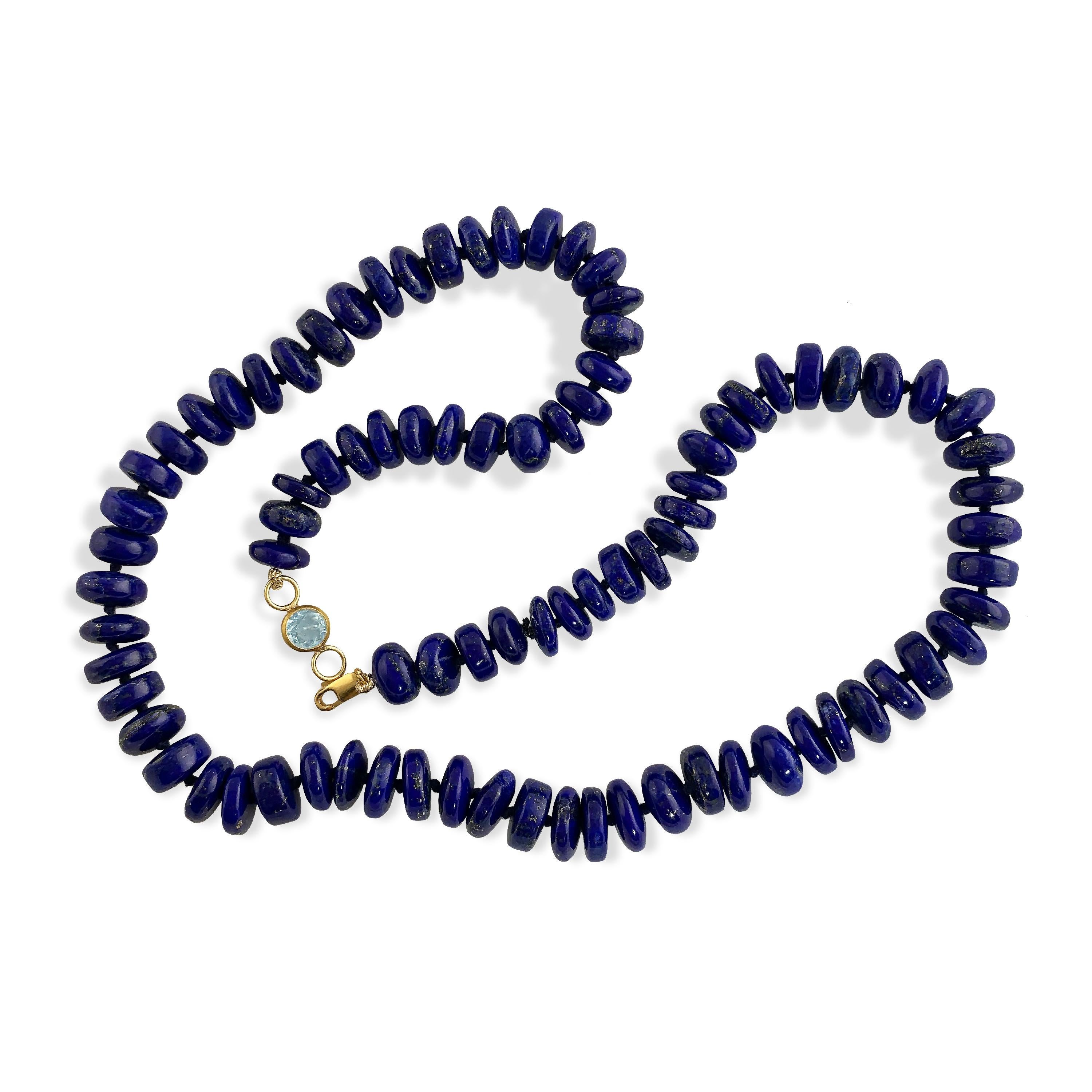 This Ico & the Bird Fine Jewelry  one-of-a-kind, dark lapis lazuli beaded necklace is perfect for layering with longer chains and displaying your most prized charm.
Handcrafted in 22-karat yellow gold with a faceted Aquamarine gemstone and lobster