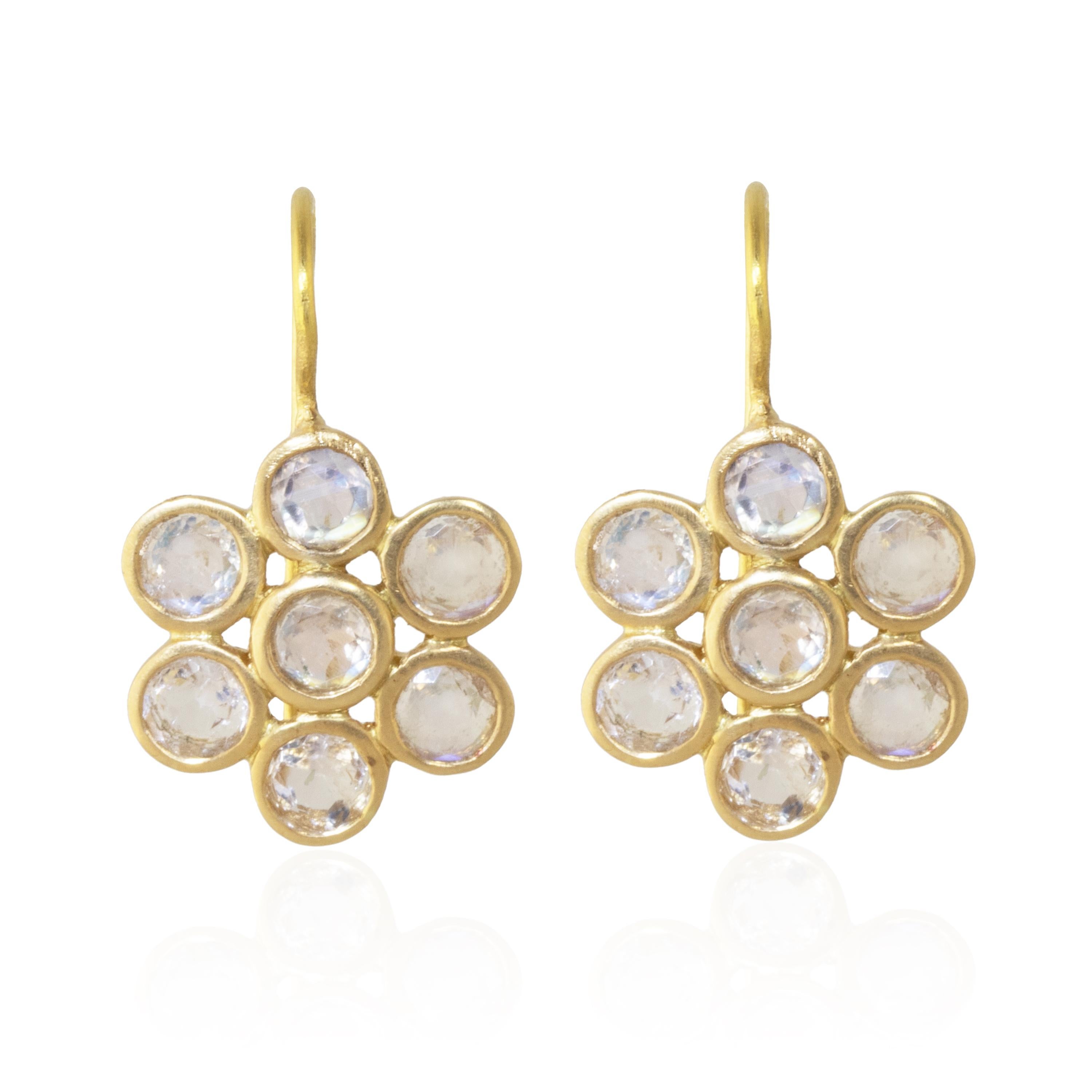 Mesmerizing with its 'glowing-from-within' shade of blue, these delicate drop earrings feature 2.48 carats of round, faceted Rainbow Moonstones set in 22k matte yellow gold.  These drops feature 14 faceted Rainbow Moonstones set in a floral design.