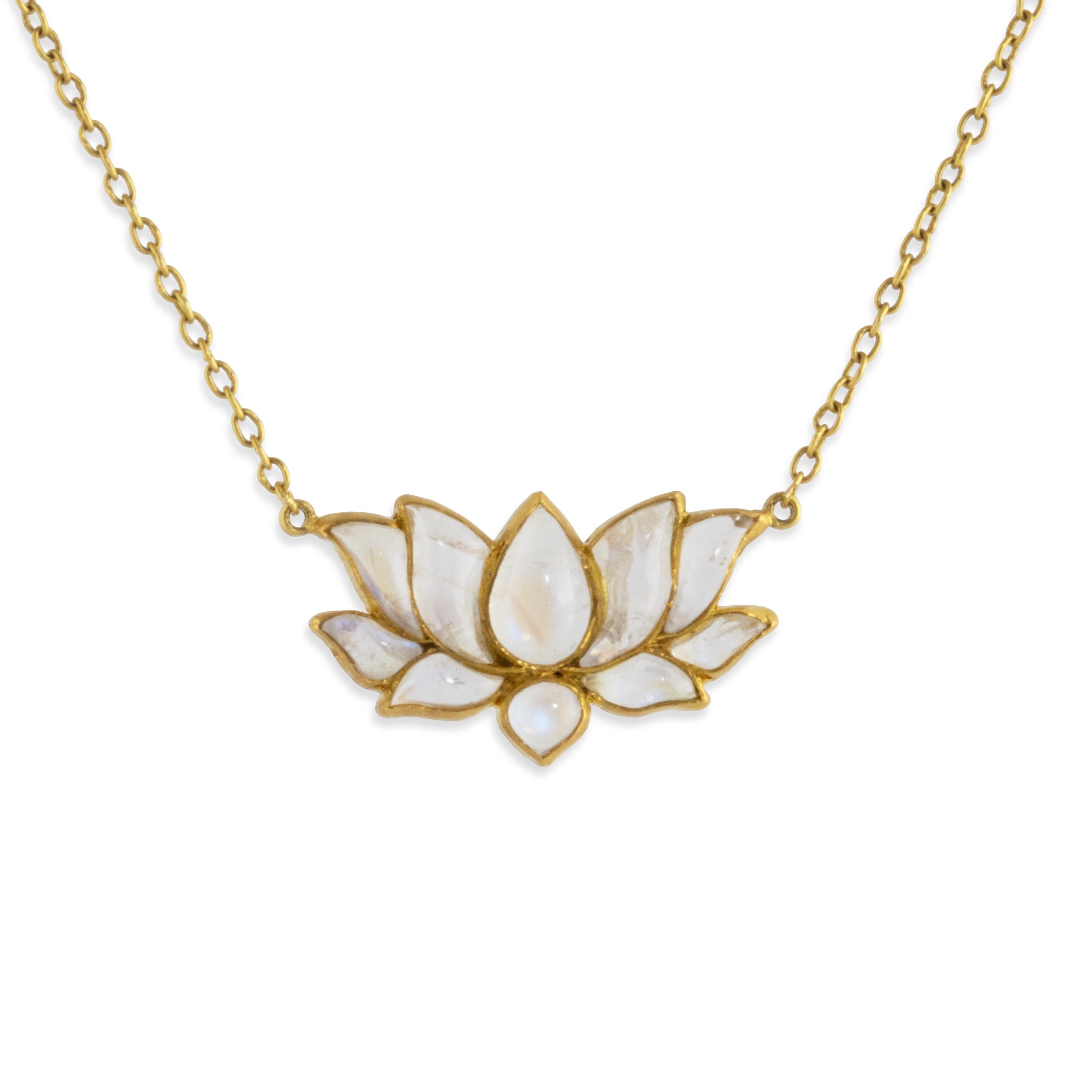 A spectacular Lotus necklace featuring a center lotus drop surrounded by multiple petals carved in Rainbow Moonstone cabochons. The pieces are set like an open blossom mosaic pattern in 22k gold. The piece is finished with a 22k hand-made gold chain