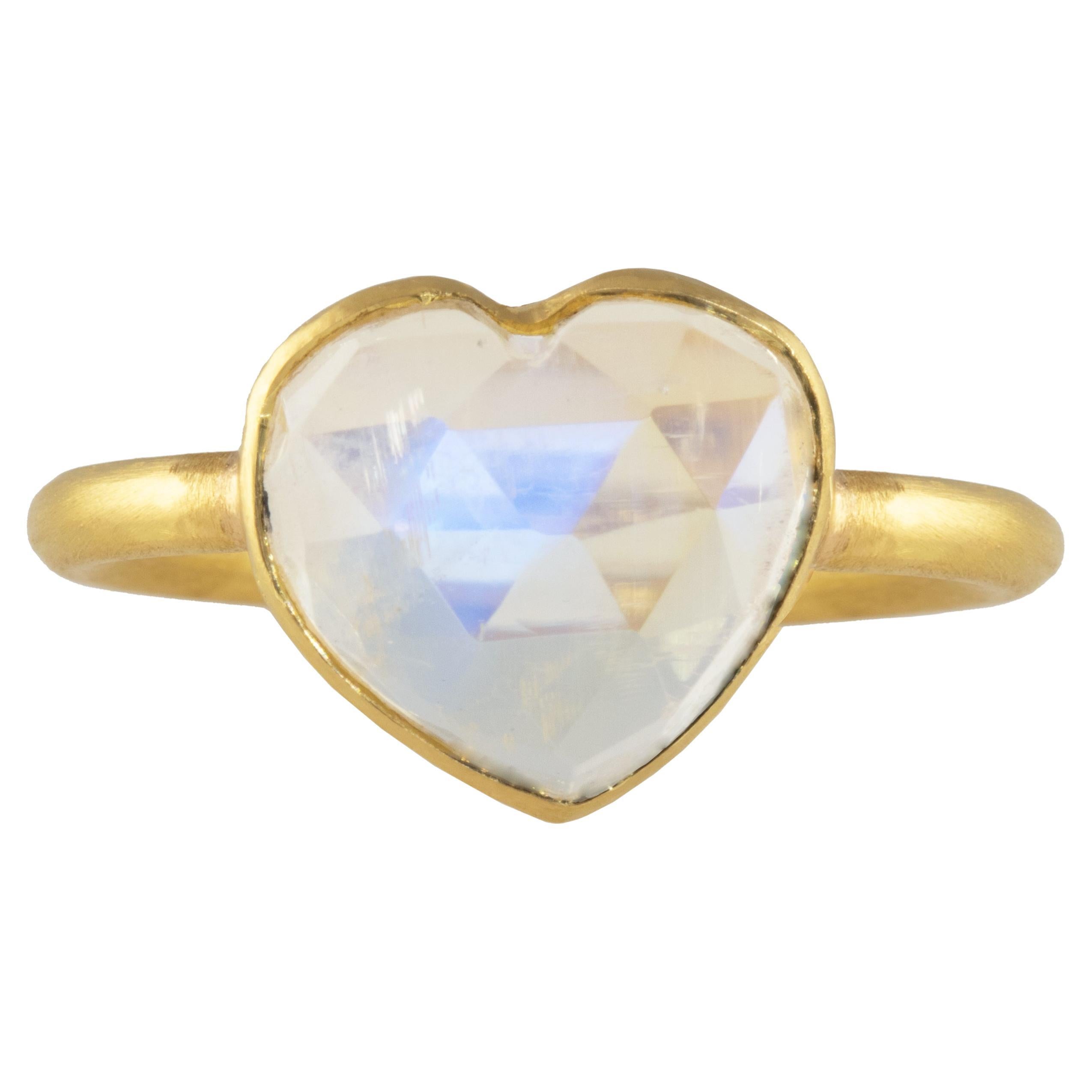 One of a kind Rainbow Moonstone Heart ring, set in 22k gold. Hand made with a checkerboard heart. 

Ancient cultures coveted the stone, believing it was created from moon beams. They also held that the Roman goddess Diana, goddess of the moon, could