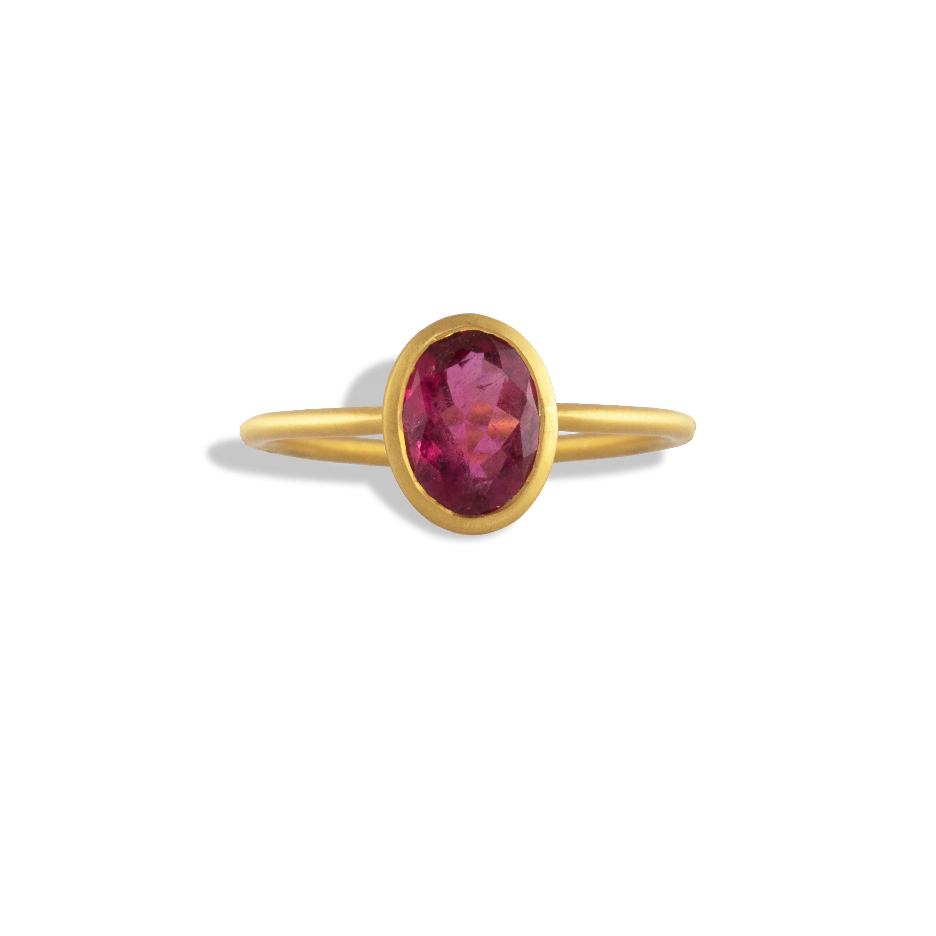 This ring features a 1.34 carat Red Spinel gemstone bezel set in 22k gold. Simple and classic.
The ring is size 6.5 but can be sized.
One of a kind. 

According to legend, spinel can help revitalize and bring energy to the owner. It is said to lower