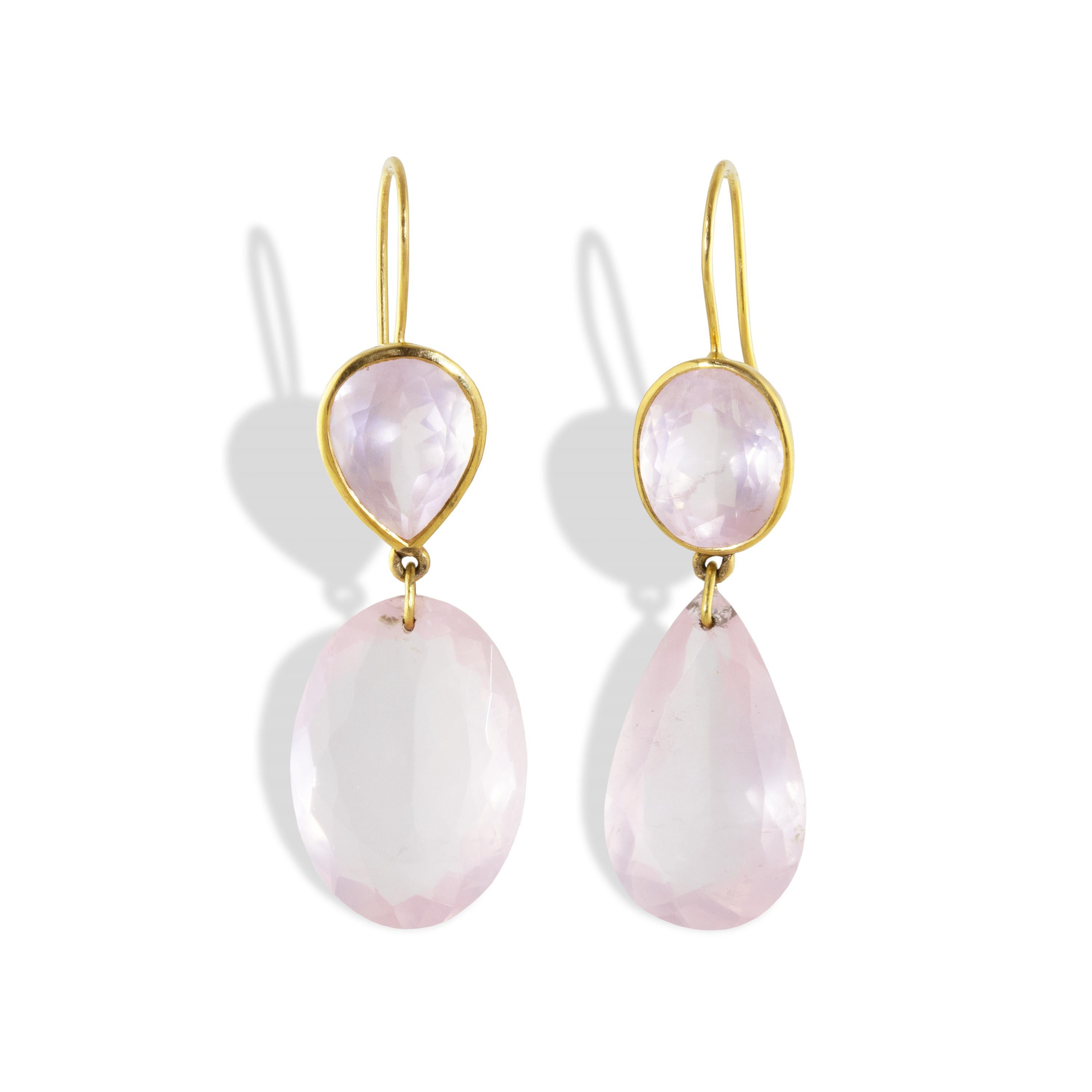 An asymmetrical pair of Rose Quartz wave  earrings featuring oval and pear shaped gemstones. Set in a high polish 18k gold with a wavy bezel, representing the ocean waves.

One of a kind

Rose Quartz is the stone of universal love. It restores trust