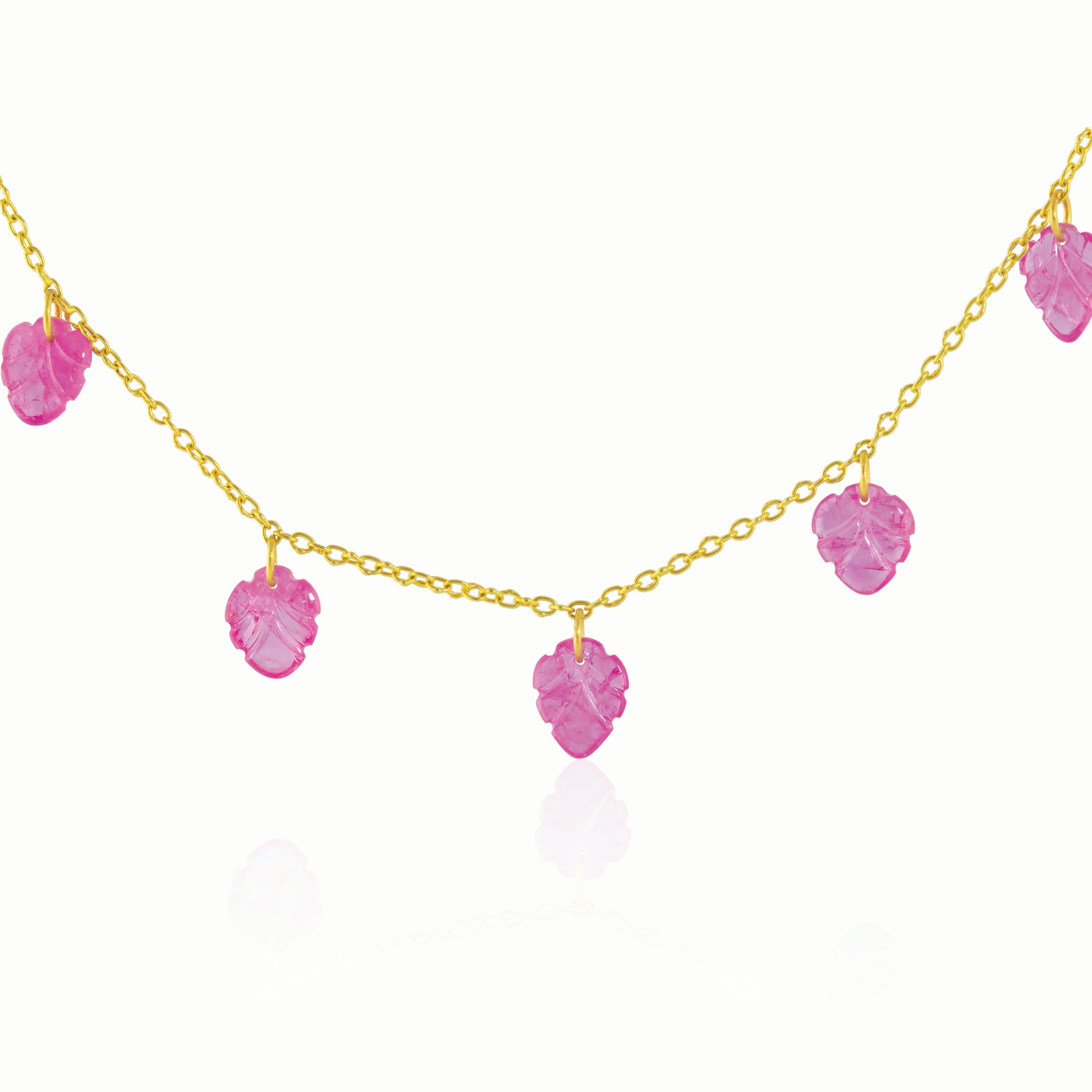 This gorgeous necklace features hand-carved ruby leaves hanging from a 22k gold chain.
Featuring Burmese pink ruby hand-carved leaf drops on a 22k gold chain, this standout necklace will necklace featuring carved ruby leaf drops on a 22k gold