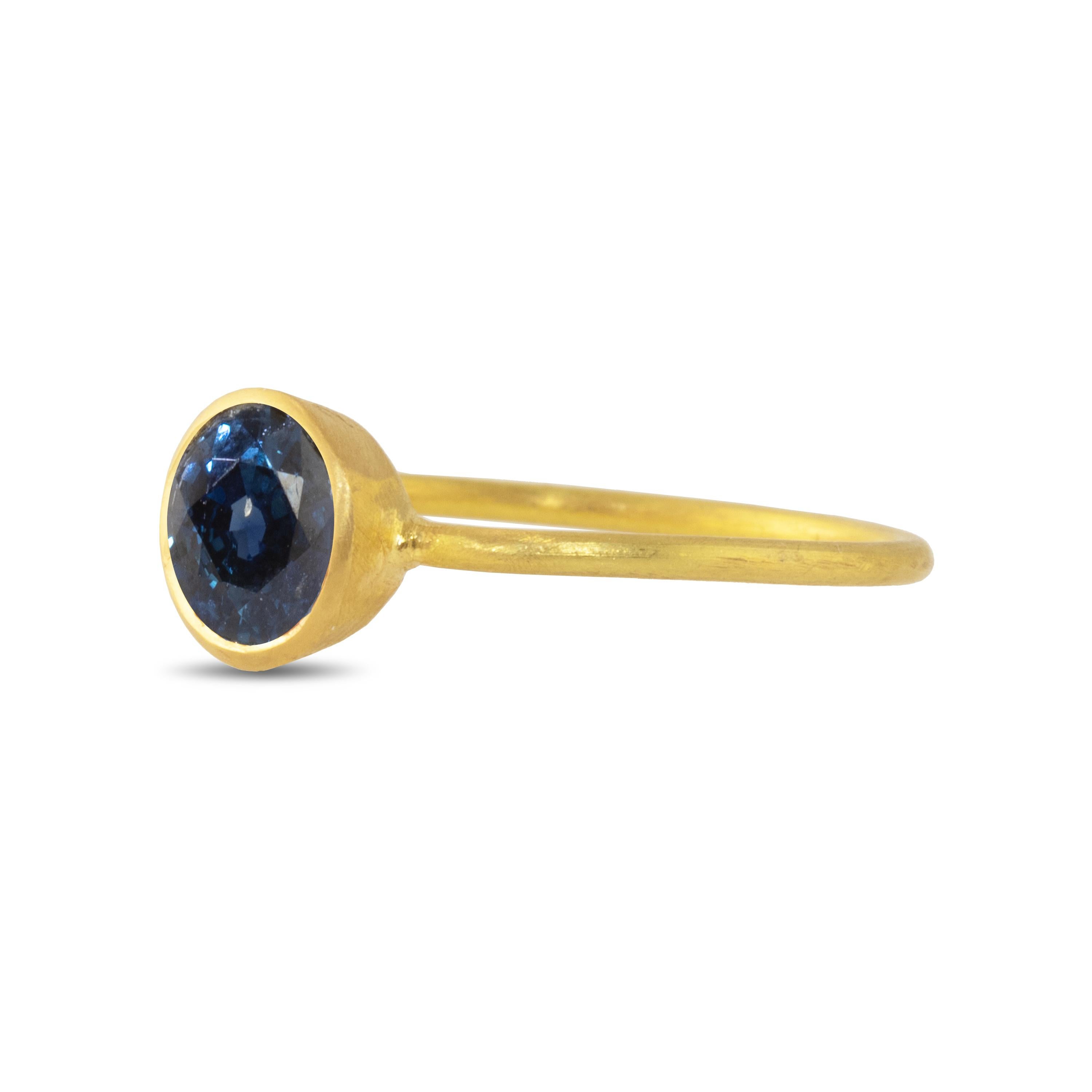 The 22k gold ring features a deep, intense natural blue sapphire. Wear this alone or in combination with other rings for a pop of color.  The sapphire is 6.65mm and .80 carats.

Sapphire is also known as a 
