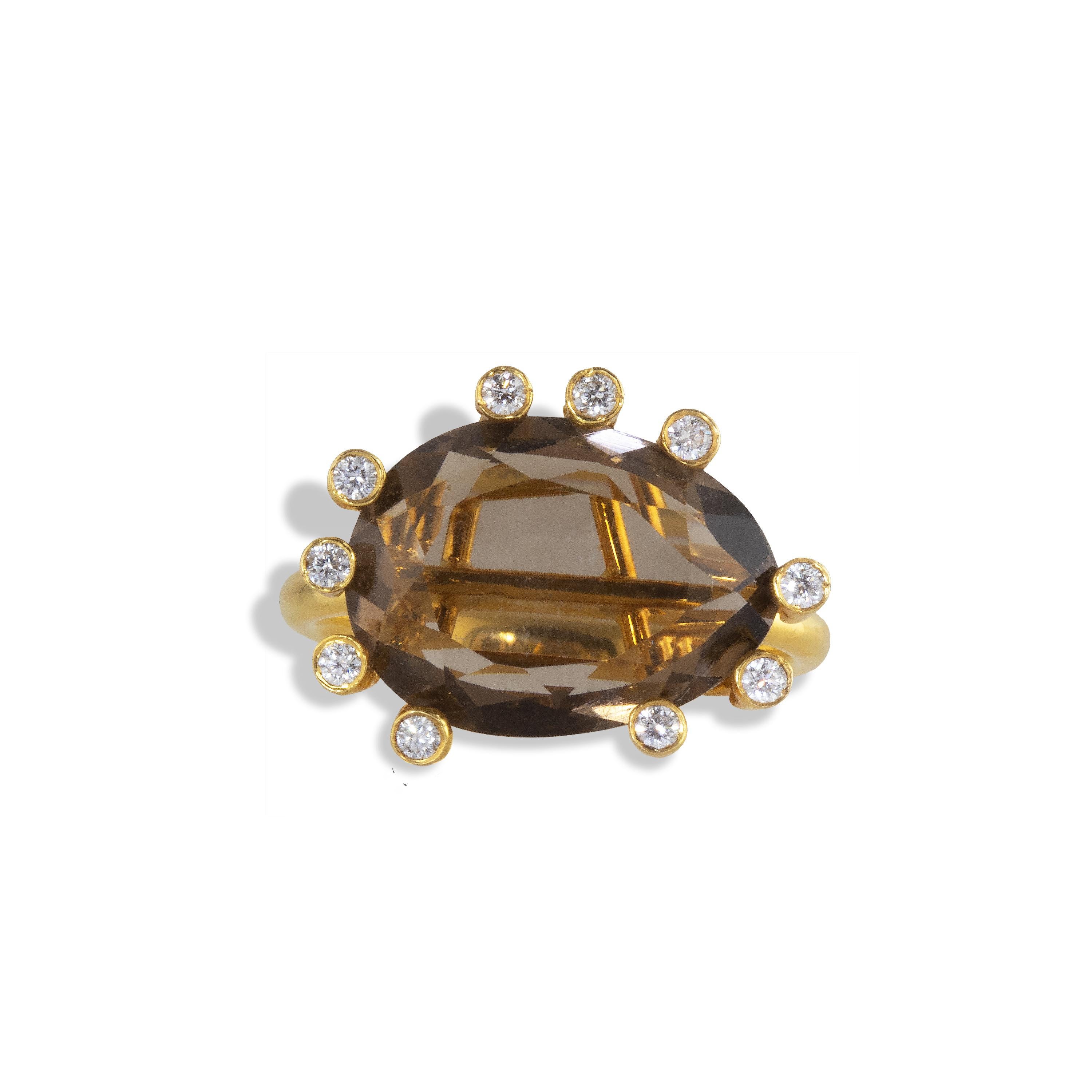 An elegant and dramatic ‘Open Cage’ ring with asymmetrical diamond clusters surrounding a 12 carat large Smokey Topaz  gemstone and .21 carats of white diamonds randomly spaced.  
Smoky quartz is the National Gem of Scotland and has been considered
