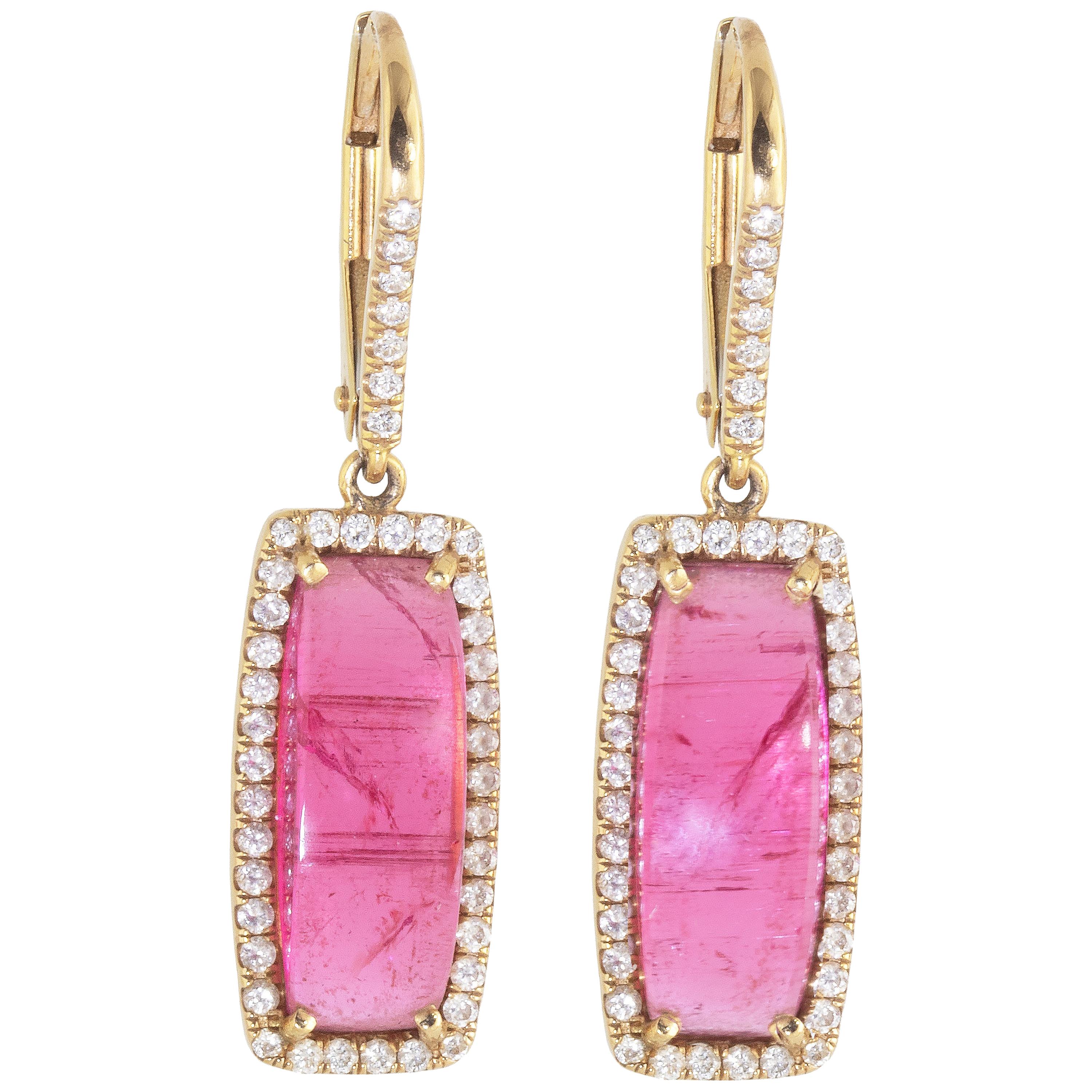 One of a kind Rubellite Tourmaline Cabochon Diamond Earrings set in 18k Rose Gold.  

These earrings were made from a single piece of Rubellite tourmaline which was chosen for its color and luster. The stones are highlighted with a diamond halo