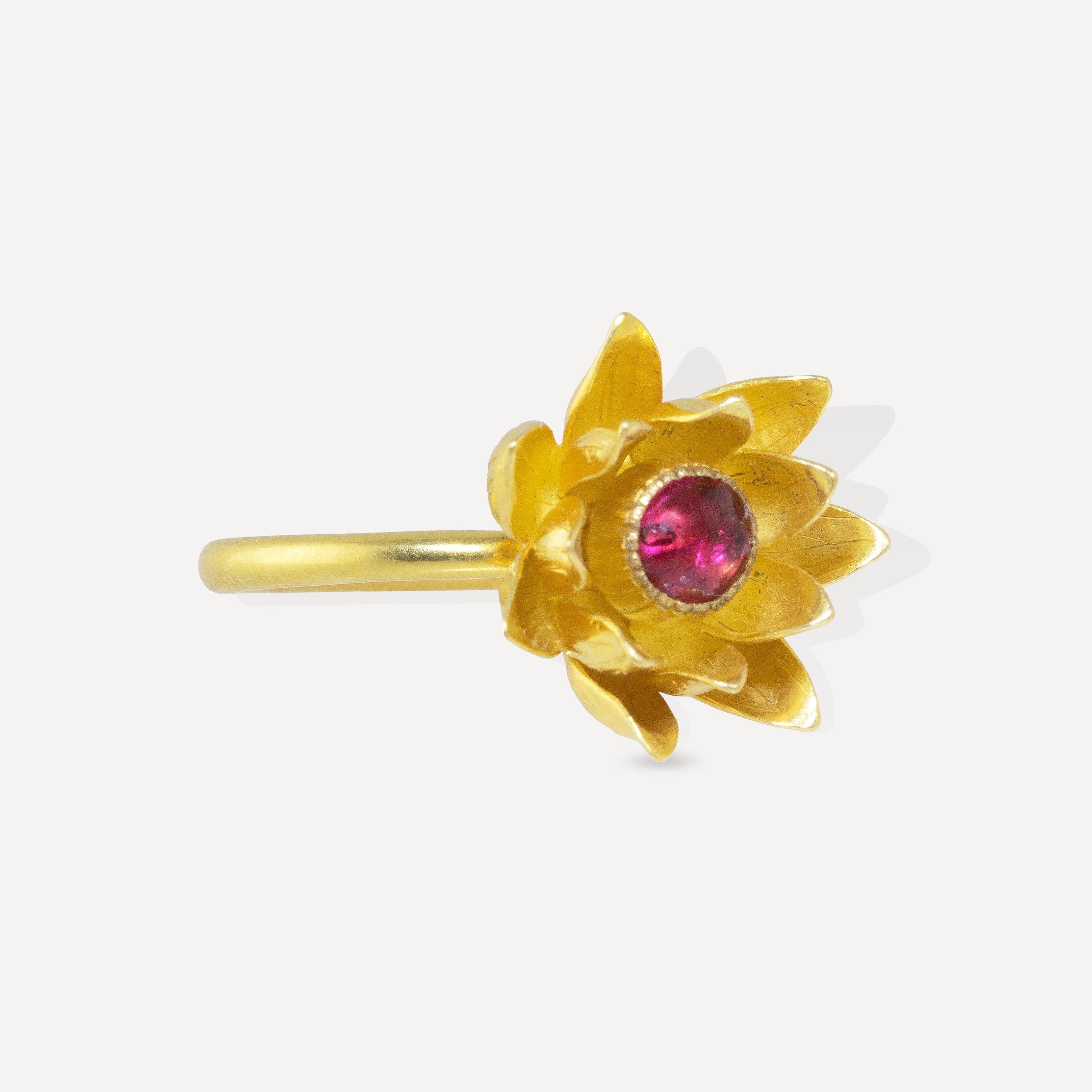 This Lotus Flower Ring features a 2 carat red spinel cabochon in the center of the lotus petals.
Made at the workshop in Myanmar by master goldsmith, Wai Lin Tun, at the workshop in Yangon, Myanmar. The petals are made in a painstaking process that
