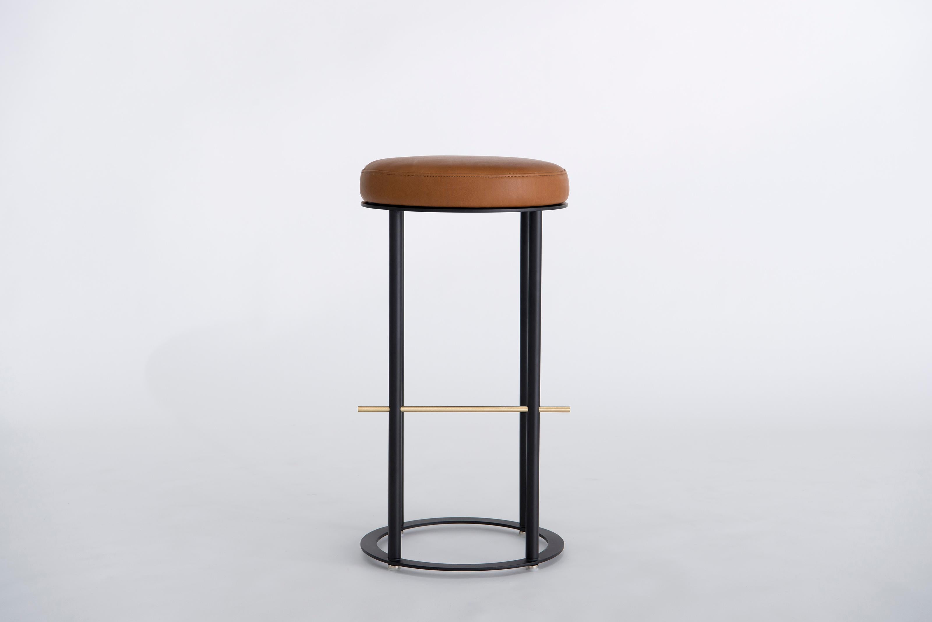 Icon Bar Stool by Phase Design
Dimensions: Ø 40.6  H 73,7 cm. SH: 73,7 cm.
Materials: Leather, powder-coated metal and brushed brass.

Solid steel and brass with upholstered top. Steel bar available in a flat black or white powder coat finish with
