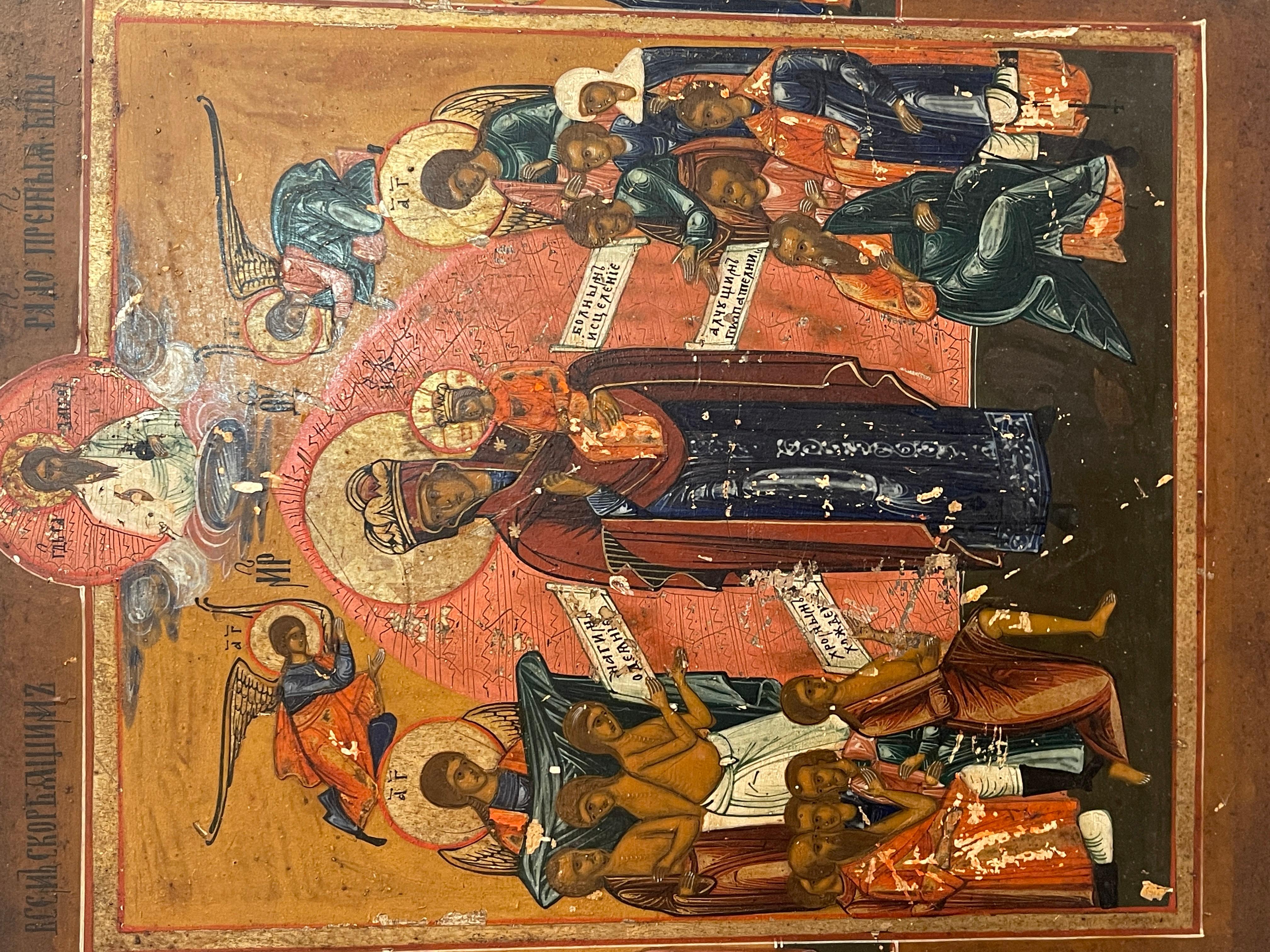 Ancient icon of fine workmanship, dating back to the 19th century, Russian. 
The icon represents the Madonna in the center with the Child, surrounded by Angels and Apostles.
In good condition, as shown in the photos, some defects and signs of wear