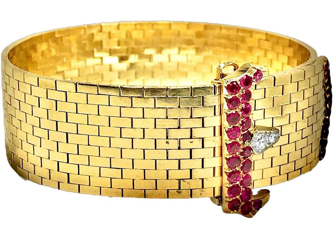 This wonderful 14k yellow gold brick link buckle bracelet screams the 1940's. This genre was the epitome of style during the mid-20th century and thousands of these, in many variations were created and enjoyed. Vivid natural rubies having a total