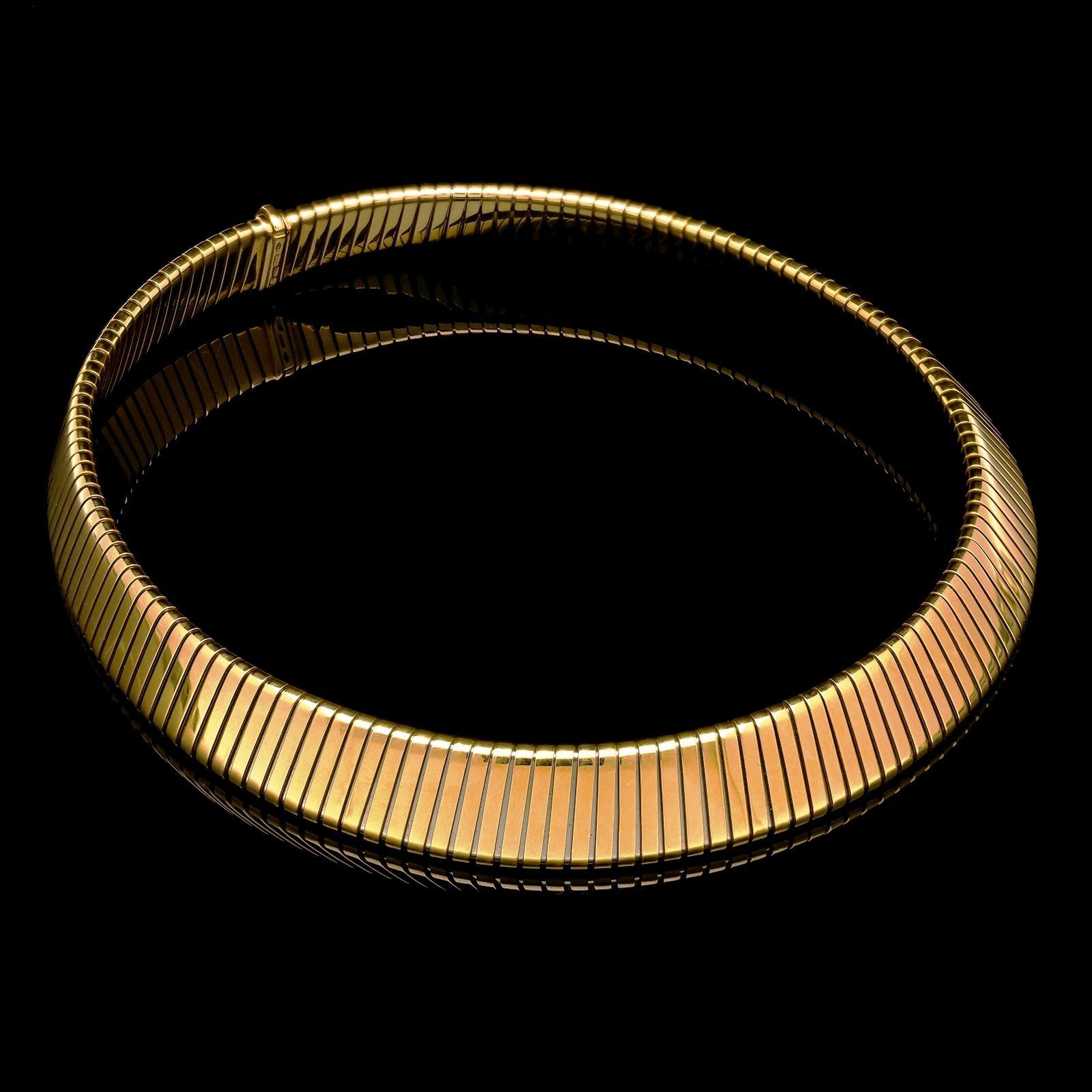 An iconic Tubogas necklace by Bulgari c.1970s, in 18ct yellow gold and of uniform design and width, the gently rounded edges smooth feel and flexible, gently expandable form of the piece making it easy and comfortable to wear, with concealed tongue