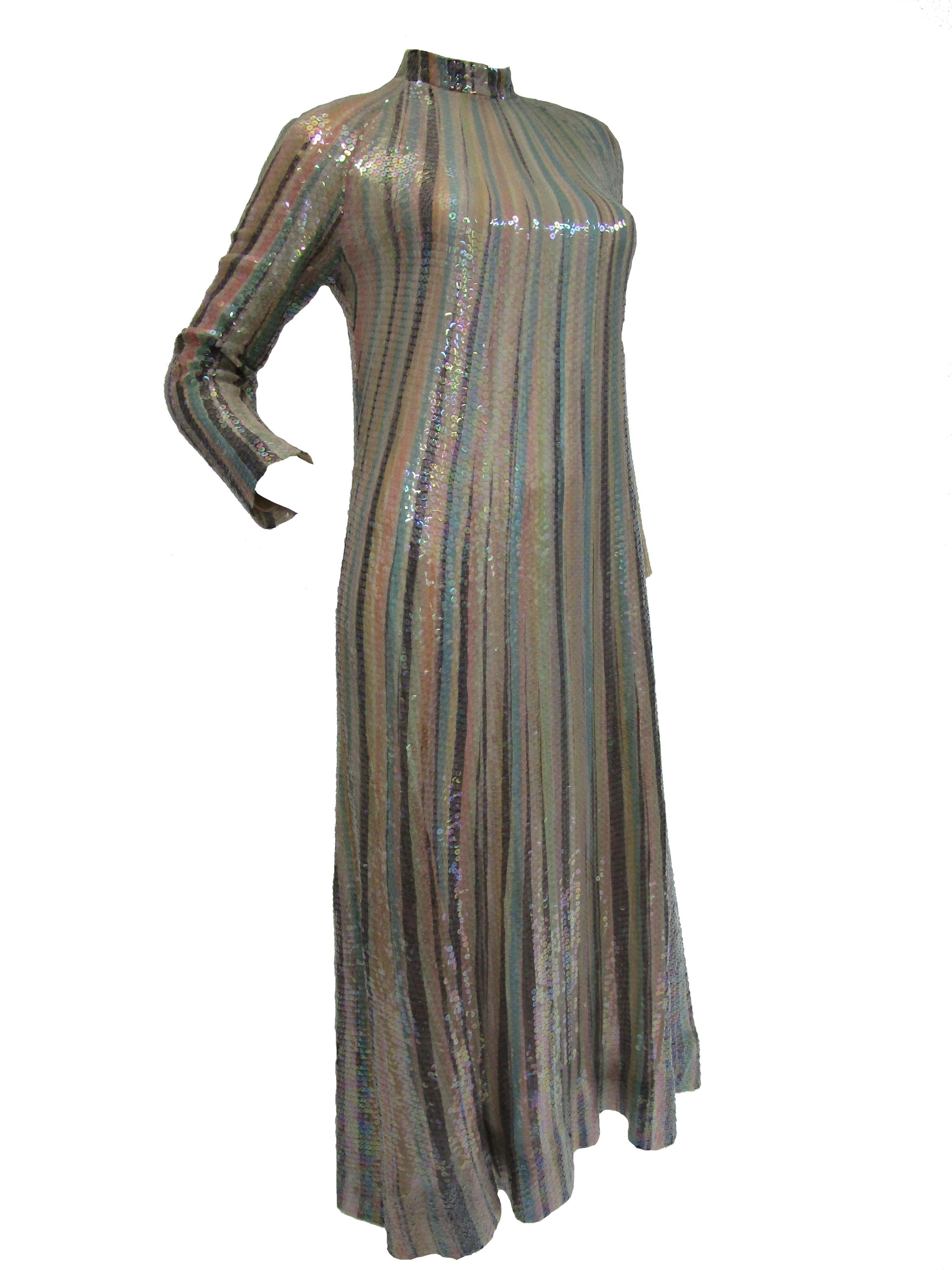 
Dazzling clear sequined dress by Halston! This full length dress includes a high neck and 14