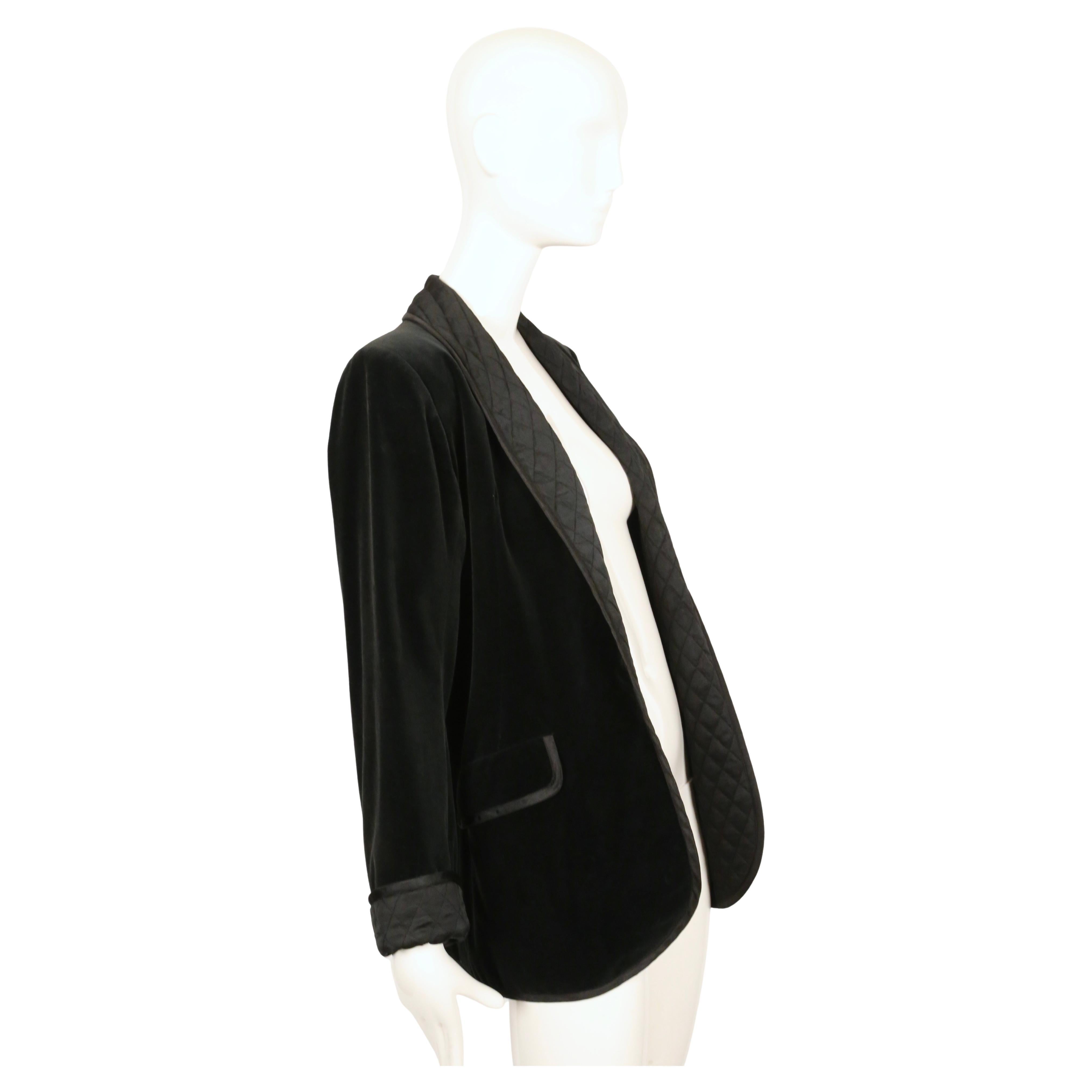 Very rare jet black velvet 'le smoking' jacket designed by Yves Saint Laurent dating to fall of 1978 as seen on the runway and various editorials. Jet black velvet with quilted black satin trim.  Jacket is labeled a French size 38. Approximate