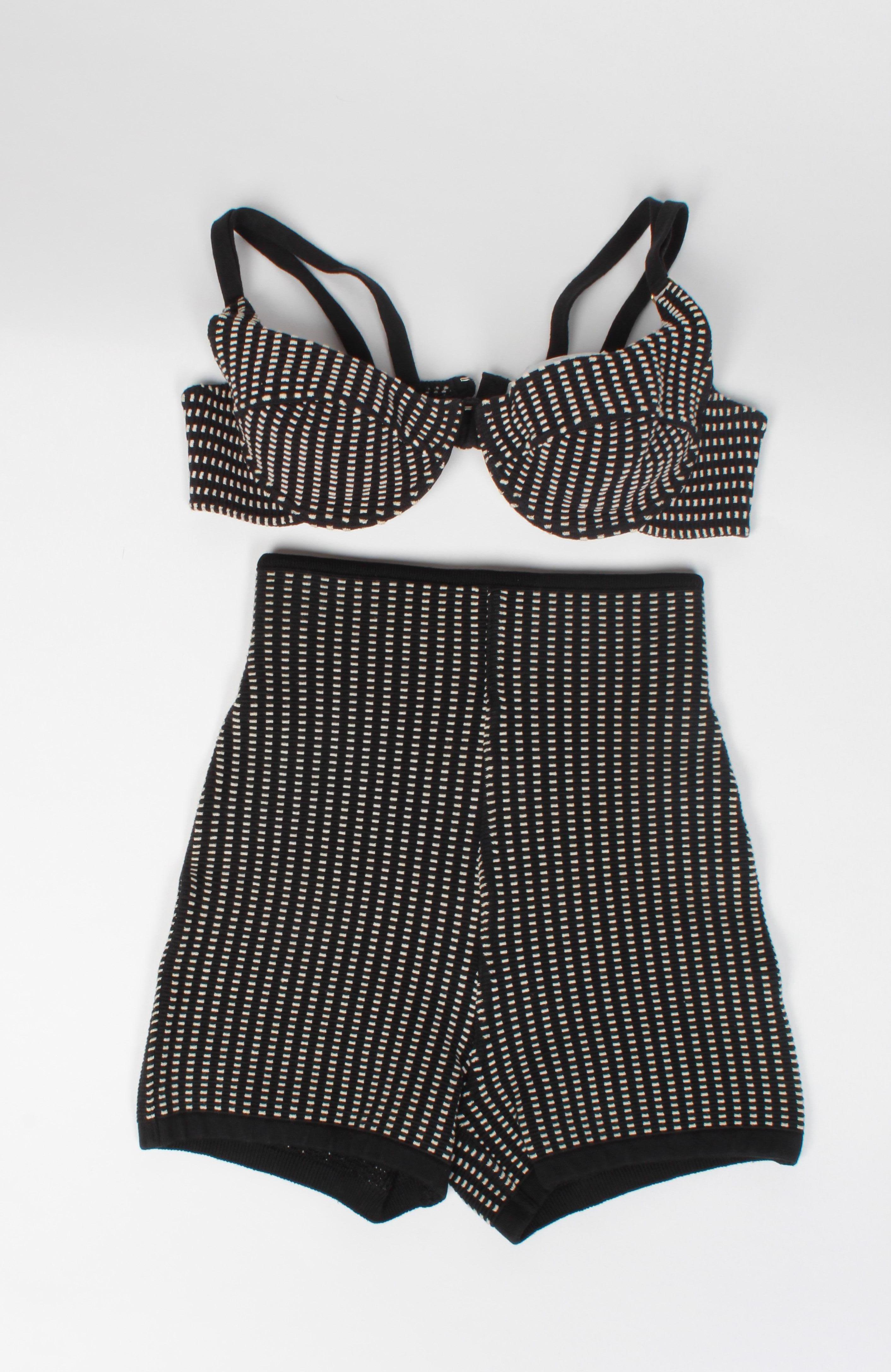 Iconic 1990's Alaia 2 Piece Swimsuit in black and white. 
Underwire cup bikini top and high waisted bottom. Very good vintage condition.
XS Made in Italy. Measurements are with garment relaxed and un-stretched.
