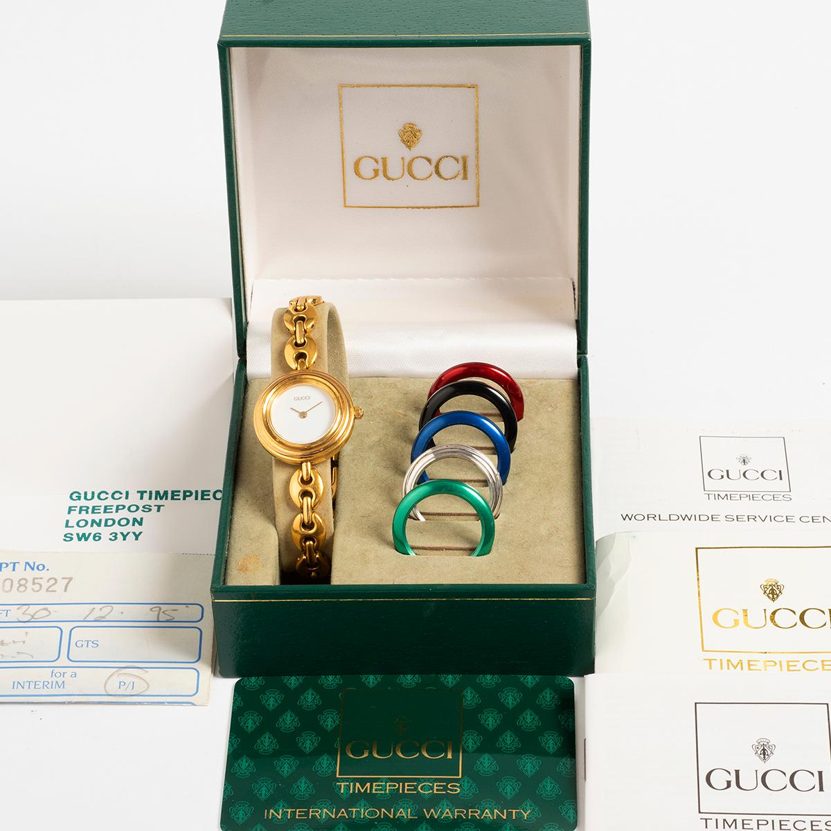 Our iconic 1990s Gucci reference 11/12.2 features a 25mm gold plated case with gold plated bracelet, and a choice of bezel colours, which are easily unscrewed and screwed on to complement the outfit! The colours are gold plated, green, silver, blue,