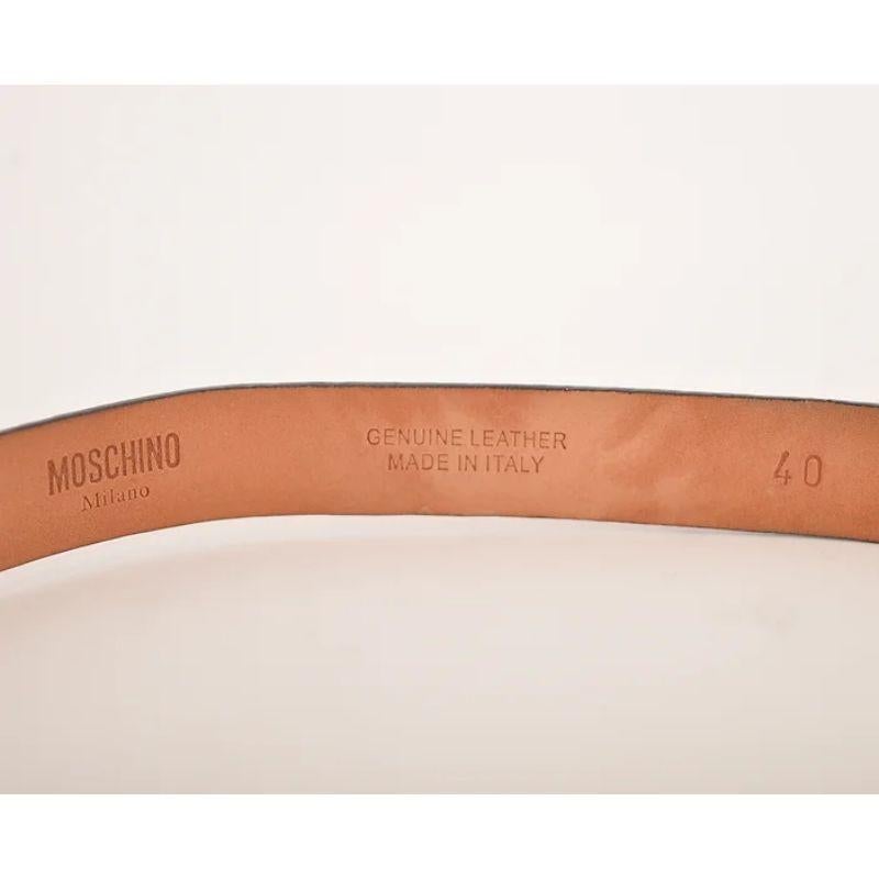 Super iconic, Vintage 1990's Moschino waist belt with 'MOSCHINO' gold tone, moveable metal lettering on a skinny red leather belt. 

MADE IN ITALY !

Features:
'MOSCHINO' Lettering
Skinny style
Rare Model
100% Leather

Adjustable Sizing given in