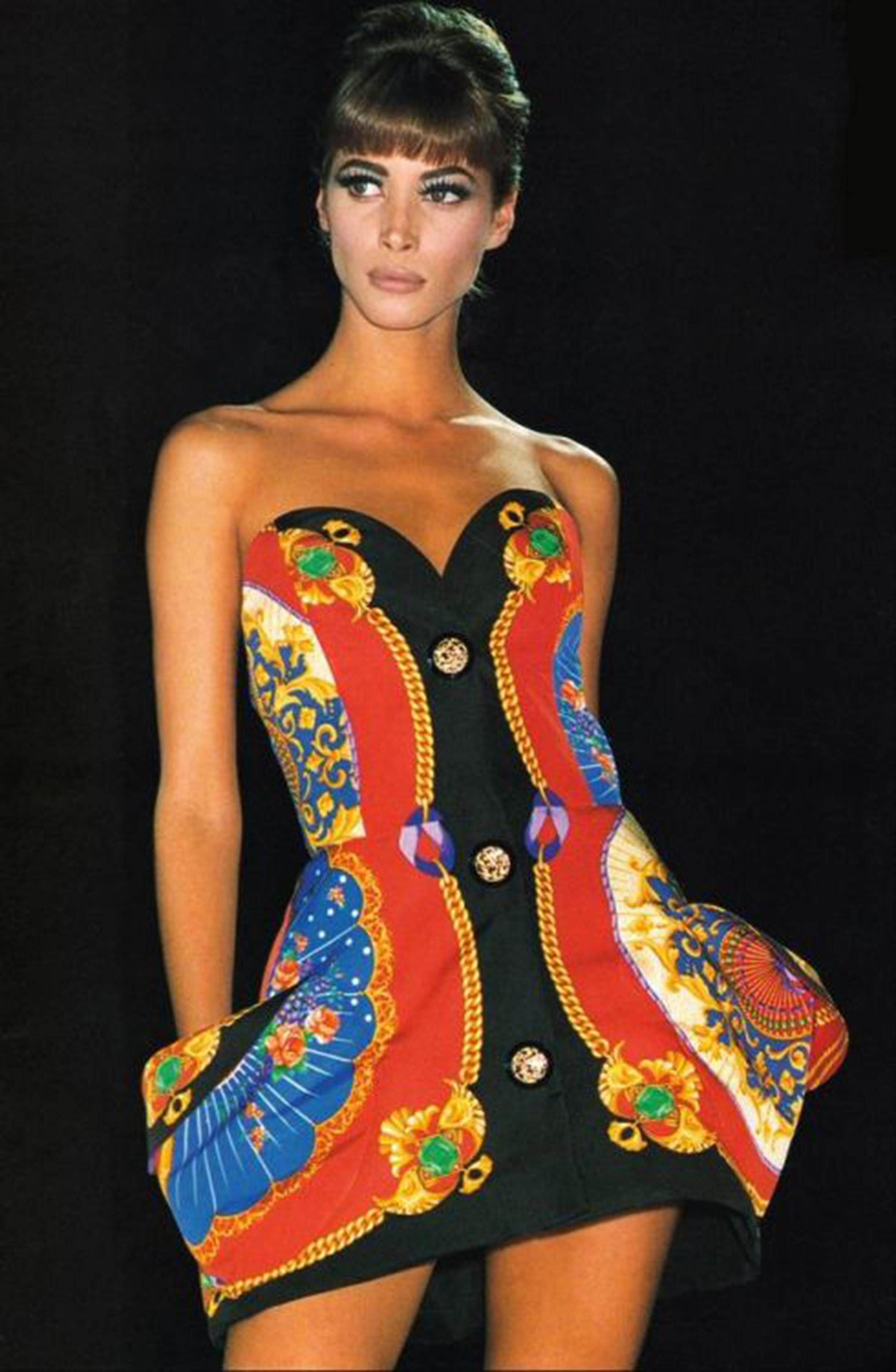 A well documented and highly coveted Gianni Versace 'I Ventagli'  print sculpted silk strapless mini dress dating back to his iconic 1991 spring-summer collection. Versace’s creations were enjoyed by the super wealthy but his impact was felt across