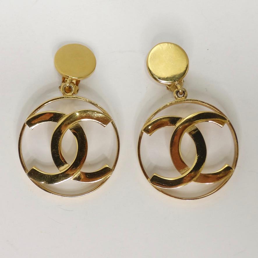 Calling all Chanel collectors! Do not miss out on the most iconic jumbo Chanel logo hoops from circa 1980s! Large solid gold plated hoop earrings with clip on backs and a signature Chanel interlocking 'C' motif in the most luxurious 24K yellow gold.