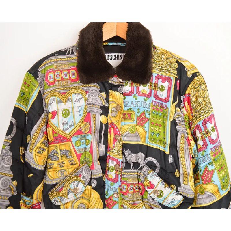 Iconic early 1990's Moschino 'CASINO' print satin bomber jacket, with a cropped fit and faux fur collar detail as well as gently elasticated waistline and cuffs.

MADE IN ITALY !

(We also have the matching skirt available to purchase separately