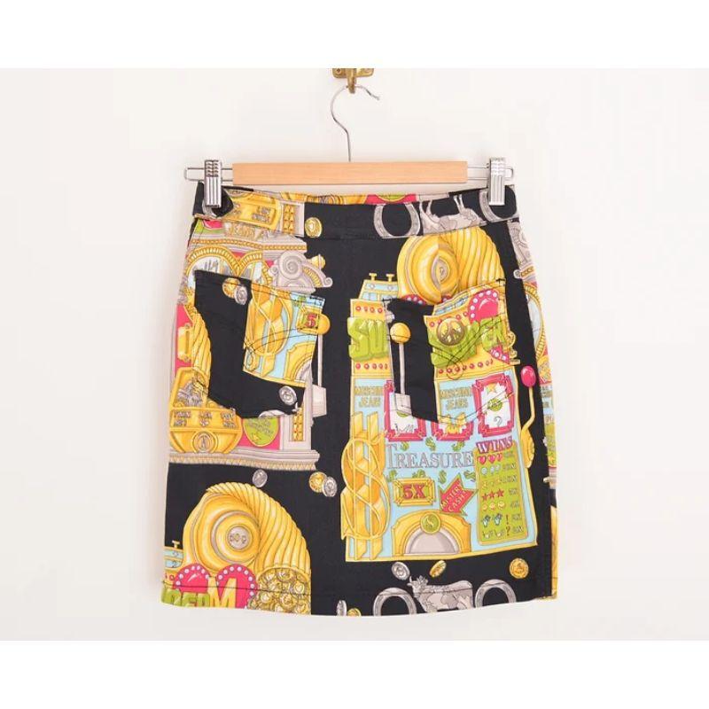 Iconic Vintage 1990's Moschino 'CASINO' print Mini skirt in a fabulous, colourful Las Vegas style pattern ! 

MADE IN ITALY !

(We also have the Matching jacket available to purchase from our store seperately) 

Features:
Concealed side zip
x2 Back