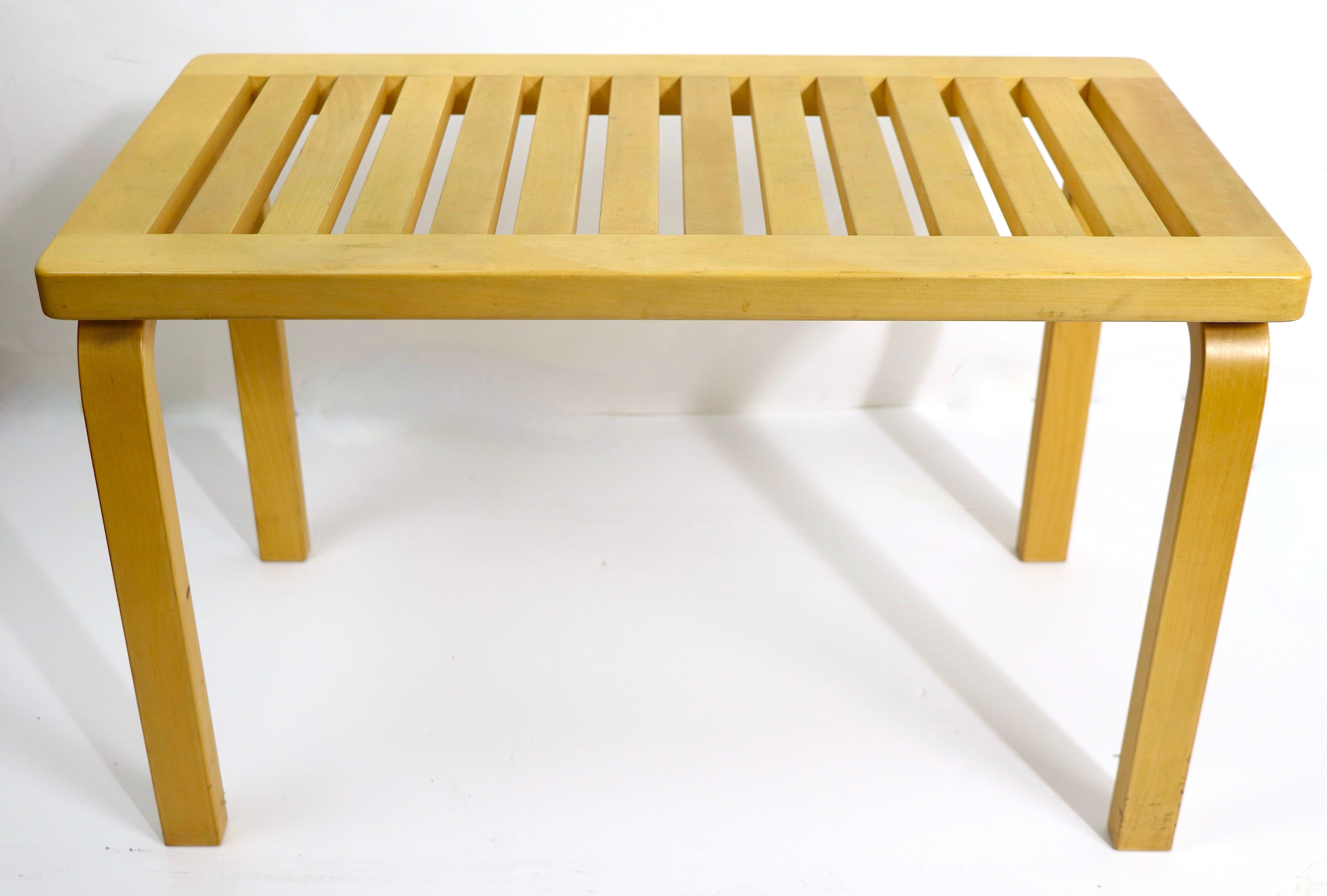 Iconic Aalto design end, side table, bench in solid wood, with slatted top. This example is vintage 1970/1980's. It is in very good, original, clean and ready use use condition showing only light cosmetic wear, normal and consistent with age.