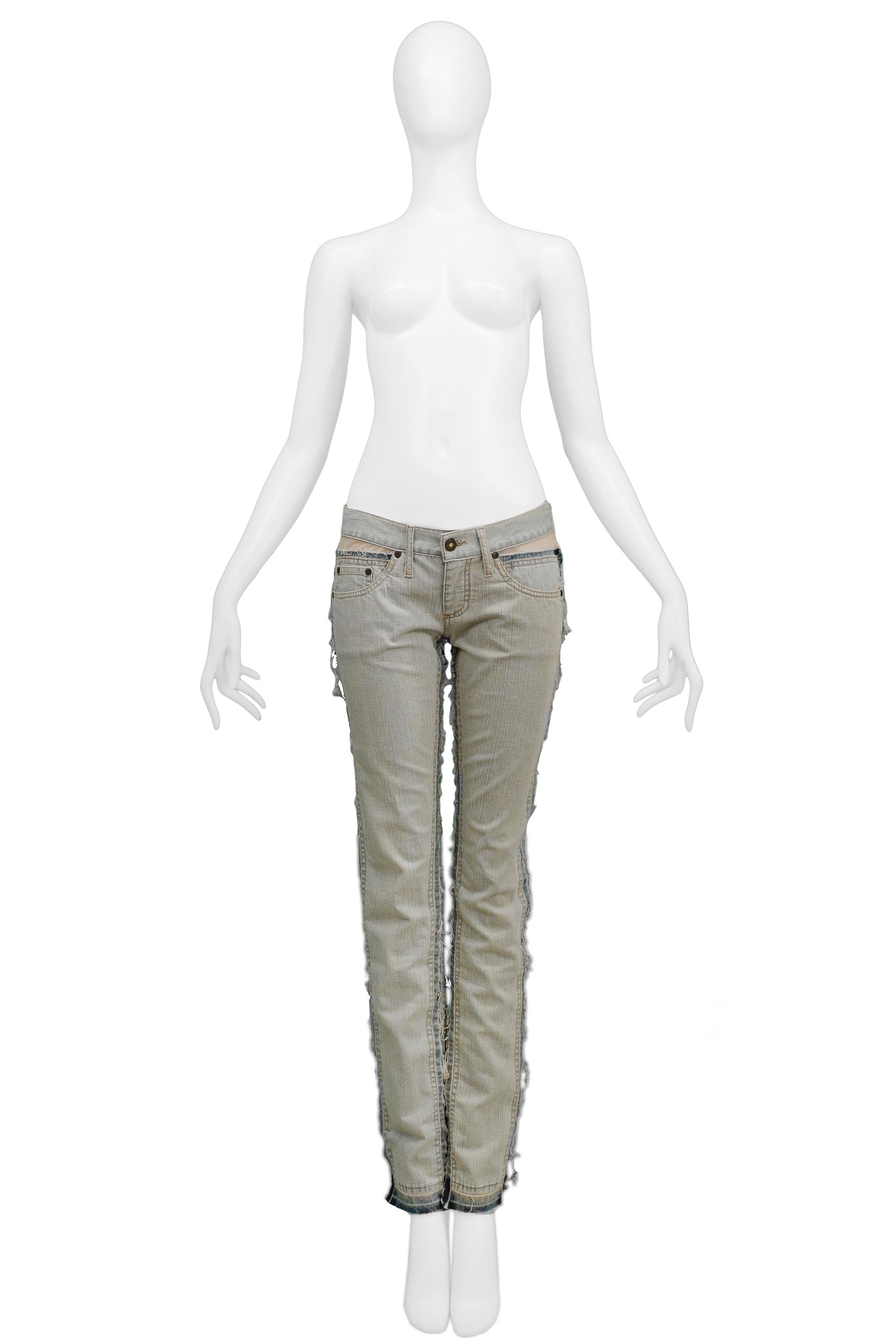 Resurrection is excited to offer a pair of vintage Alexander McQueen light denim jeans featuring mesh panel inserts on the inside and outside of the legs and on front and back yoke, five pockets, and skinny legs. 

Alexander McQueen Label
Size