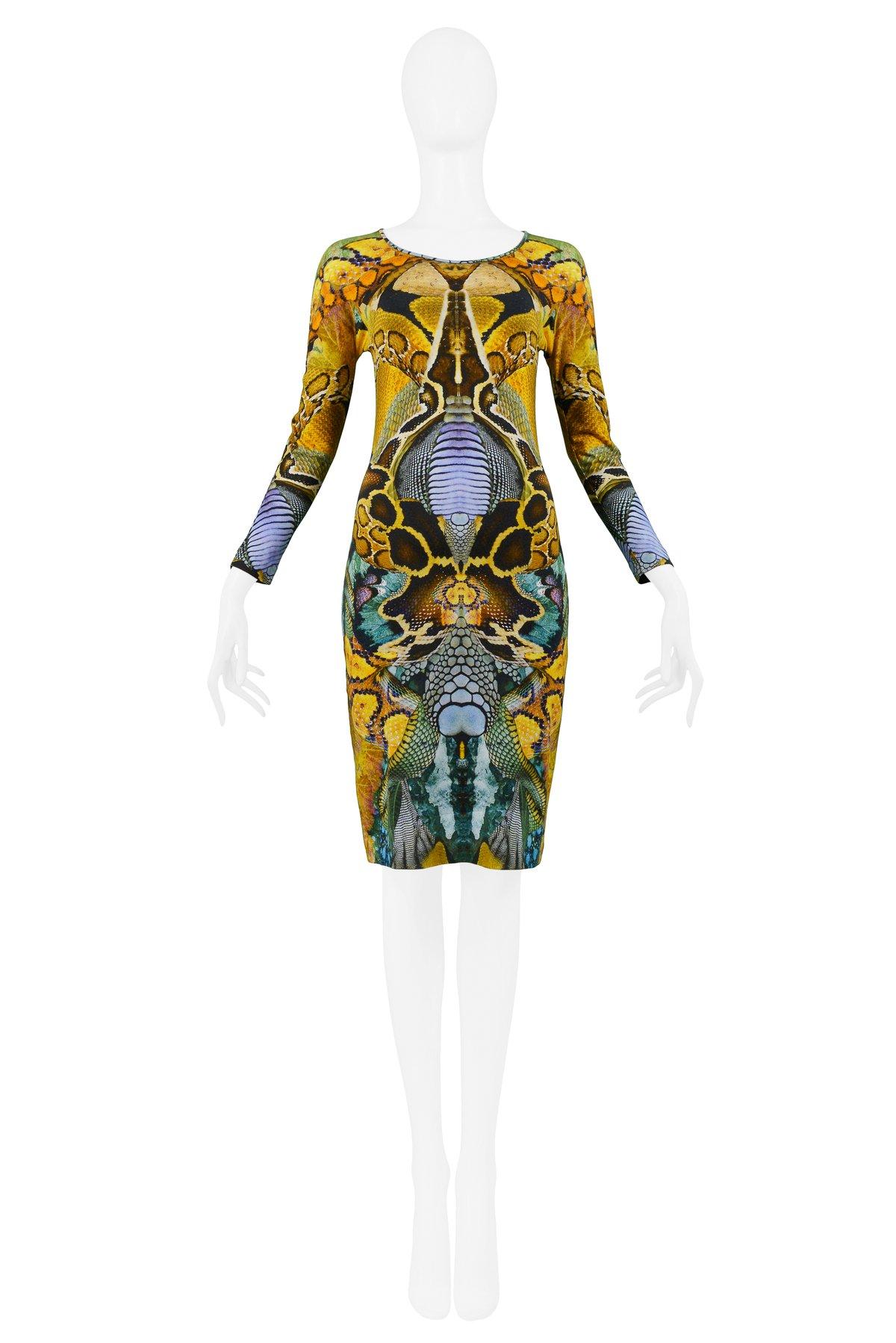 Resurrection Vintage is excited to offer an Alexander McQueen silk jersey body-con dress from the Plato's Atlantis collection, featuring a scoop neck, above the wrist length sleeves, iconic reptile digital print, and knee-length hem. The dress is