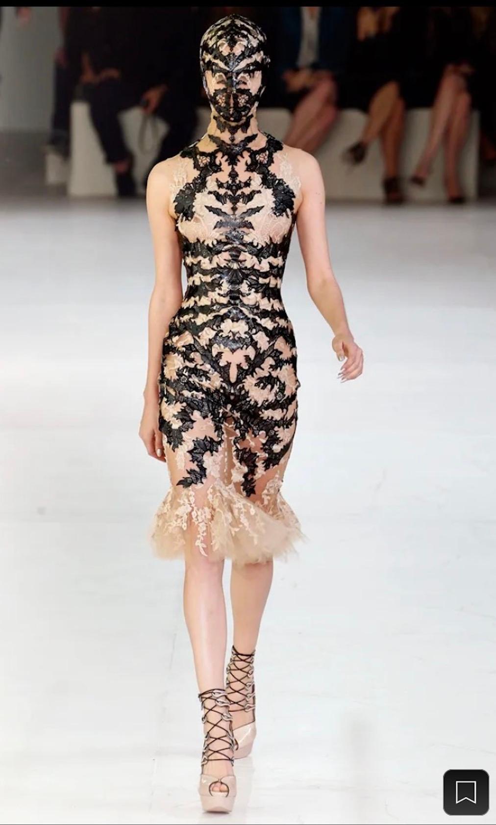 Absolutely iconic Alexander McQueen SS 2012 Laser Cut Spine Lace Dress.

Exuding an enigmatic allure that's both cutting-edge and timeless, the Laser Cut Black Leather Lace Dress from Alexander McQueen's 2012 collection is a testament to the fashion