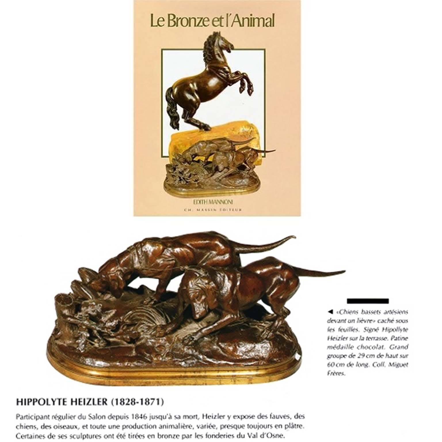 Hippolyte Heizler (1828–1871).
Two dogs standing in front of a hare hiding under the leaves.

Large bronze statuette with brown medal patina.
Molded oval base. Signed on the base 