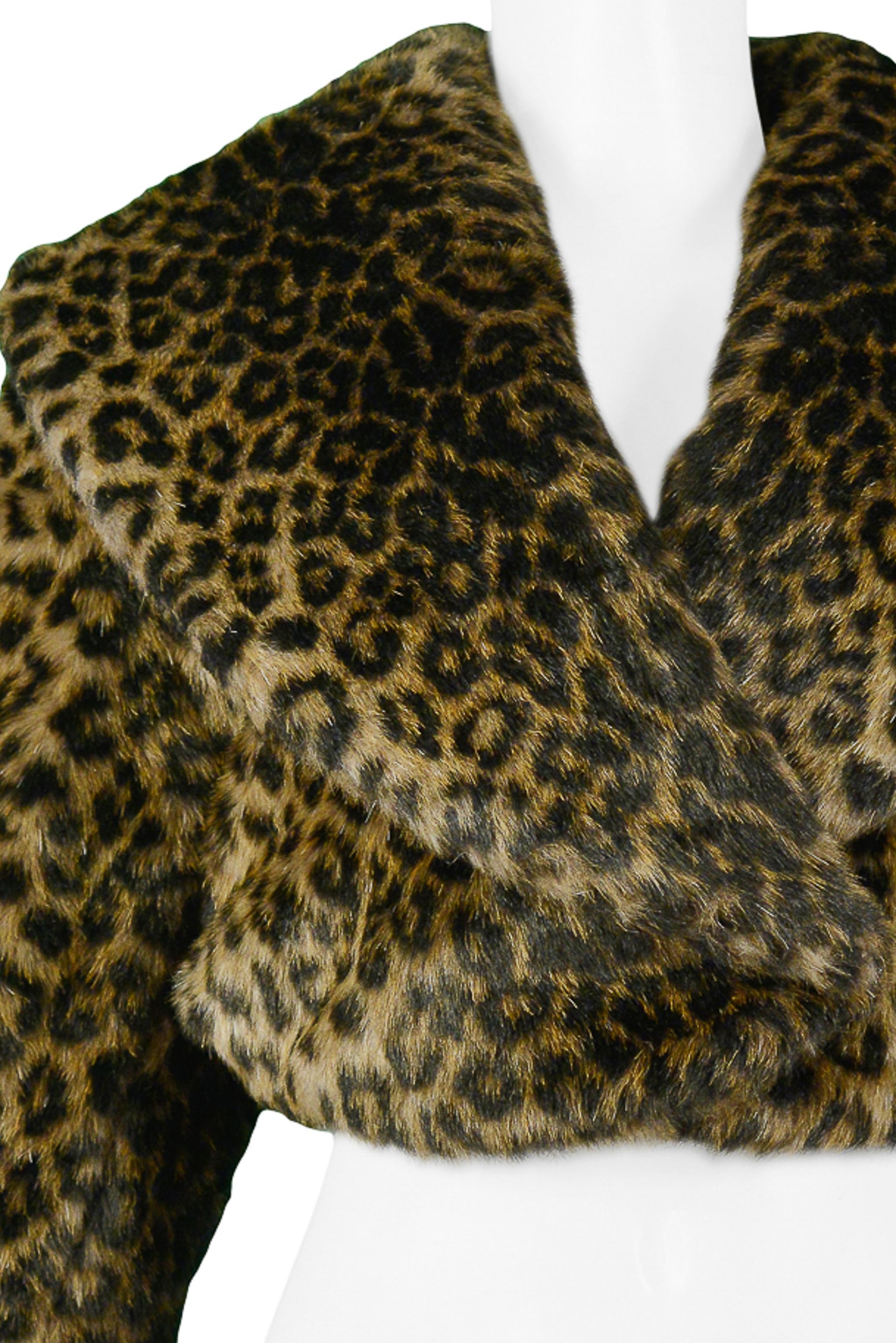 We are excited to offer a rare vintage Azzedine Alaia leopard faux fur cropped jacket. This stunning and luxurious jacket features a dramatic oversized shawl collar, overlapping front flaps, and hook and eye closure. Collection AW 1991.

Alaia
