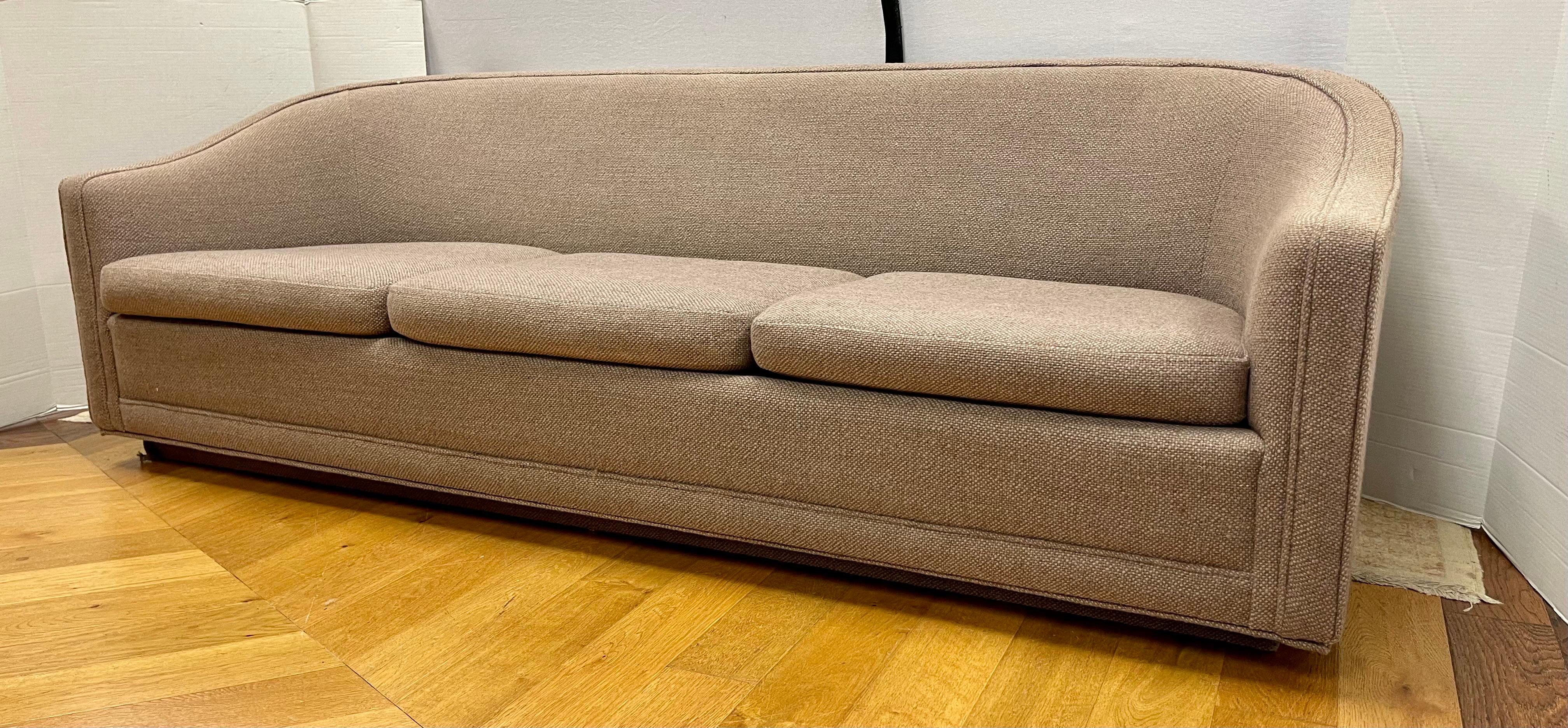 This rare modern living room sofa  three-seat sofa was designed by Benjamin Baldwin with original Jack Larsen fabric for Larsen Furniture in the style of Ward Bennett.  All hallmarks are present.  This is a remarkable sofa for many reasons which